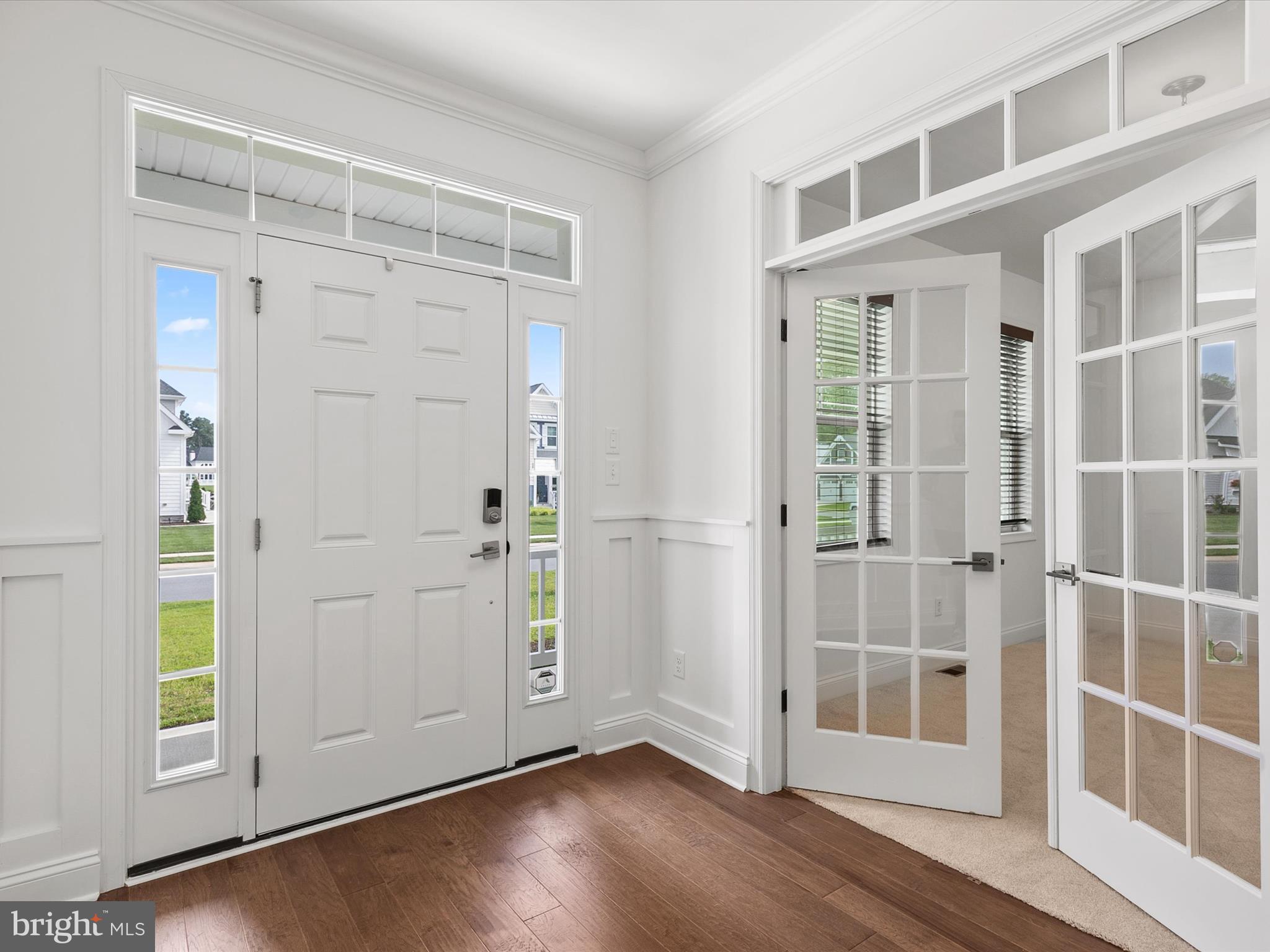 21650 Eastbridge Loop Lewes, DE 19958 - Photo 19 of 106 a view of empty room with windows and entryway