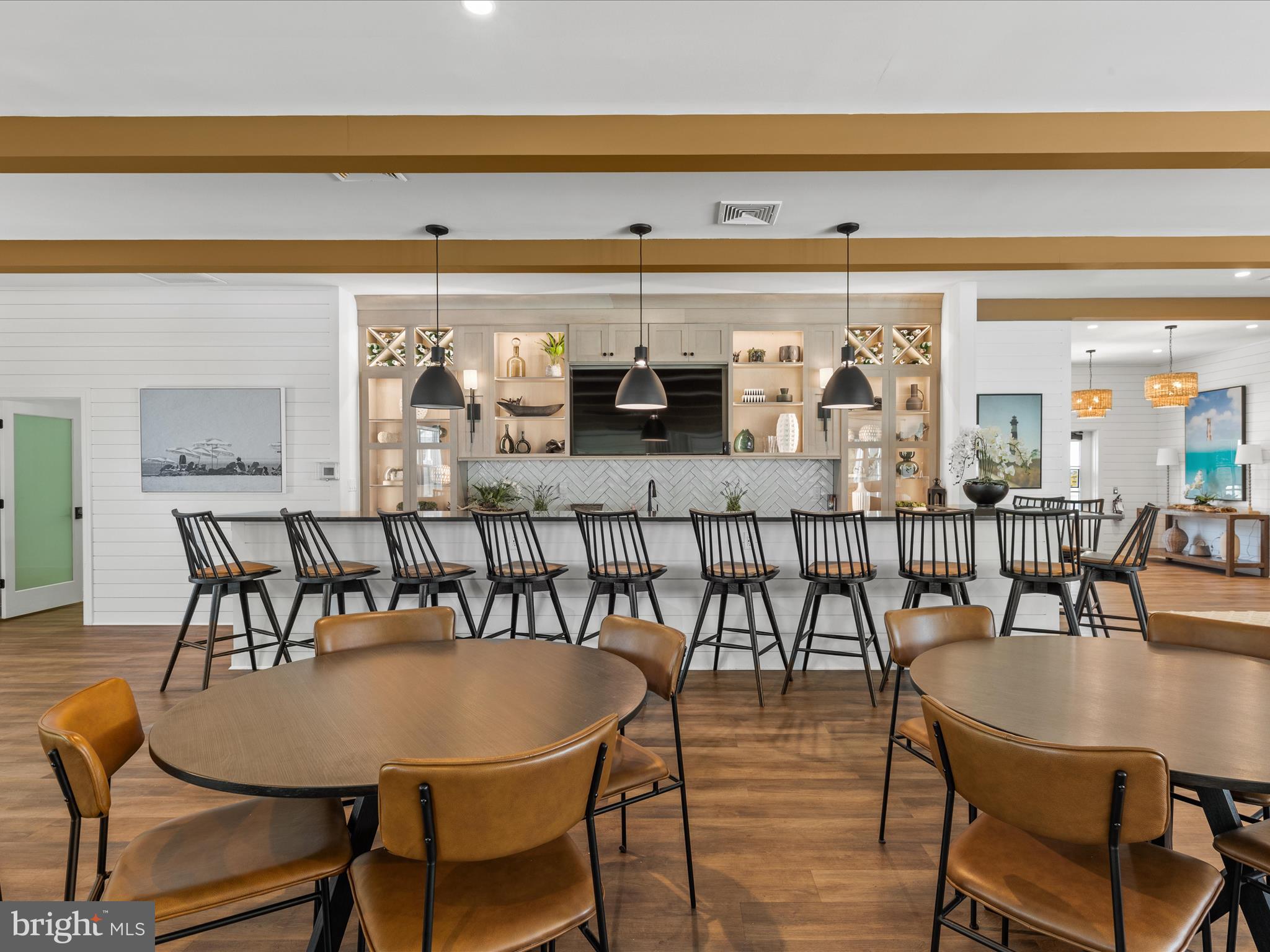 21650 Eastbridge Loop Lewes, DE 19958 - Photo 58 of 106 a view of a dining room with furniture and wooden floor