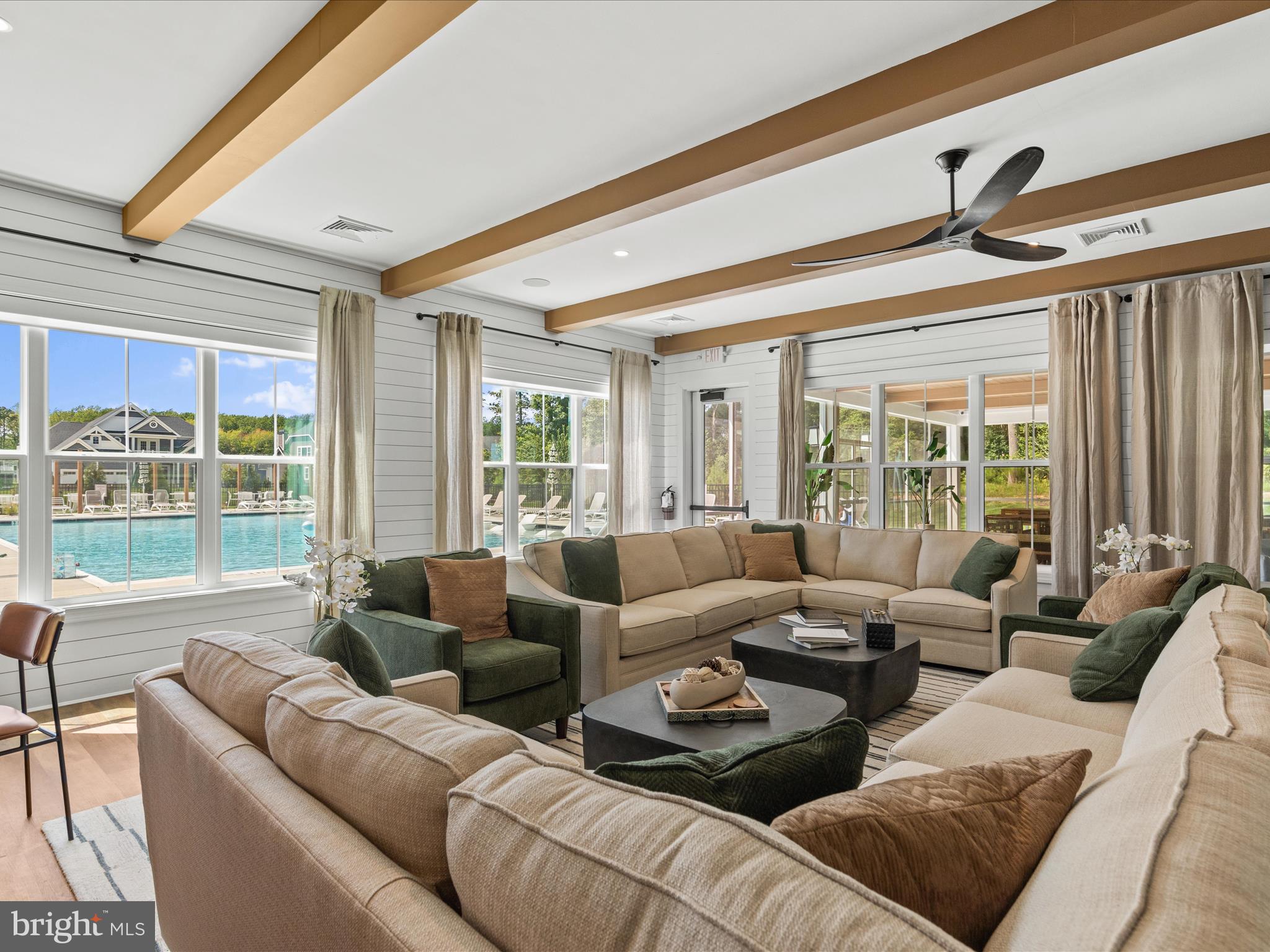 21650 Eastbridge Loop Lewes, DE 19958 - Photo 59 of 106 a living room with furniture and a large window