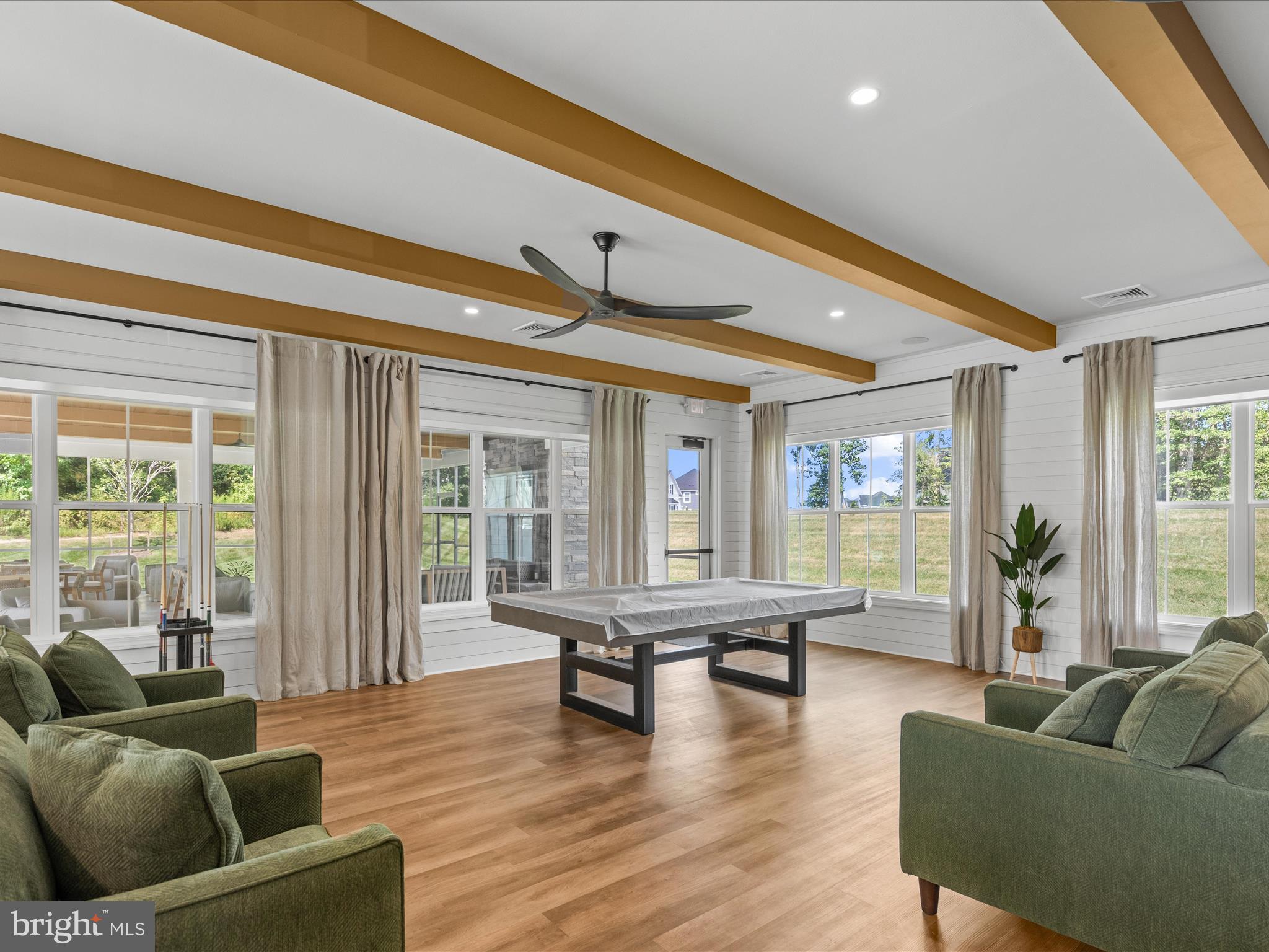 21650 Eastbridge Loop Lewes, DE 19958 - Photo 60 of 106 a living room with furniture and a large window