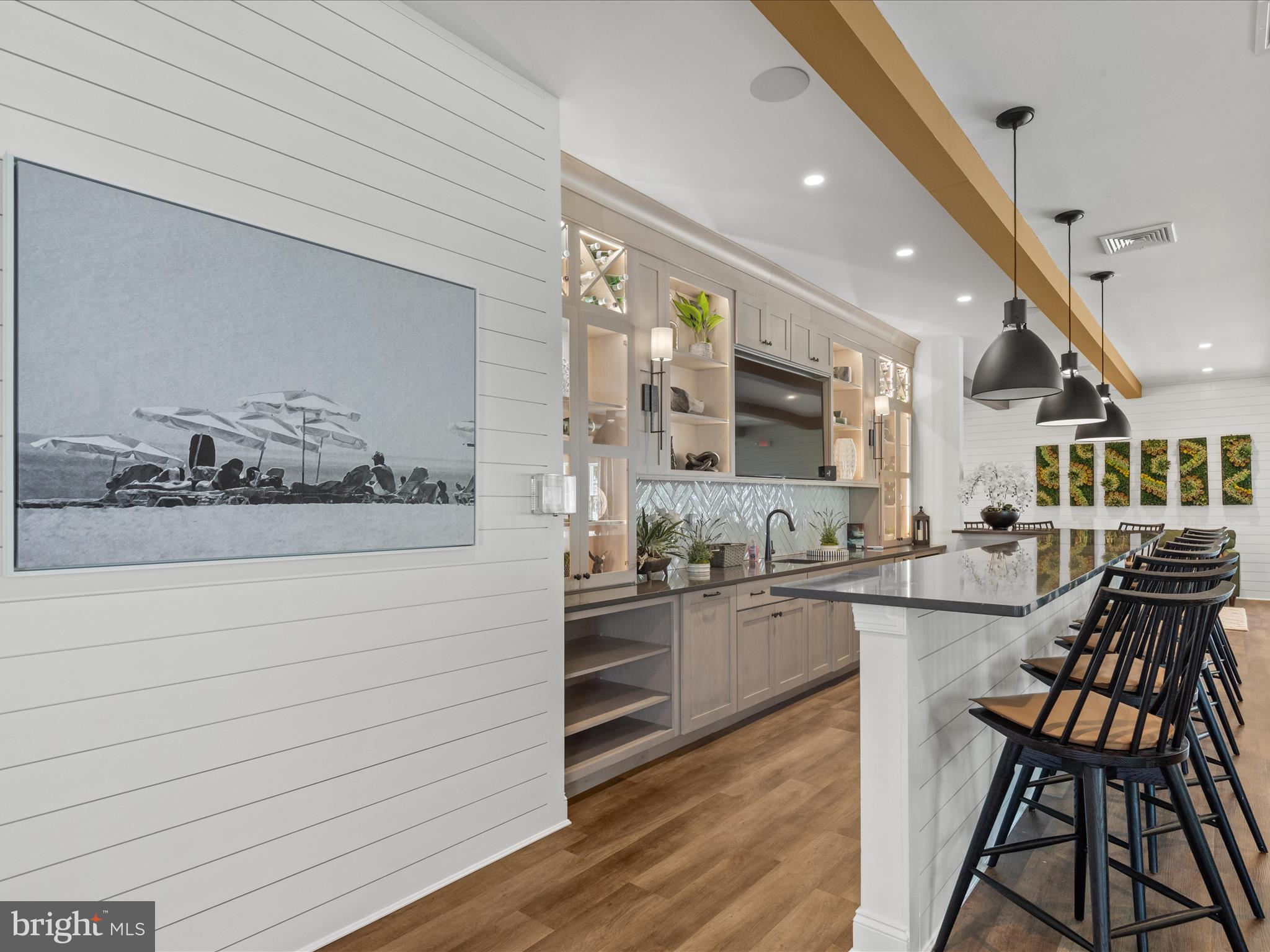 21650 Eastbridge Loop Lewes, DE 19958 - Photo 61 of 106 a kitchen with stainless steel appliances kitchen island granite countertop a stove and cabinets