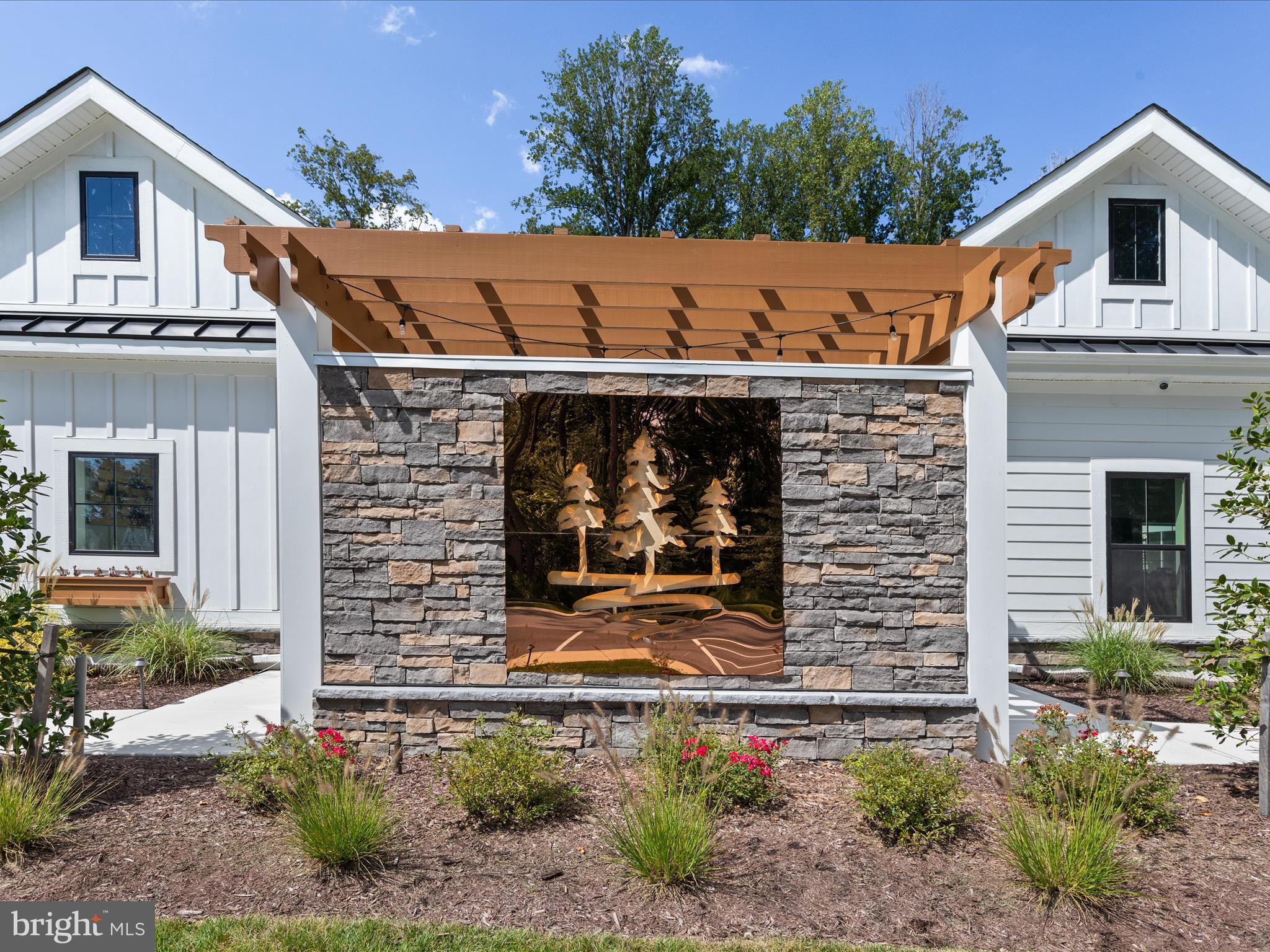21650 Eastbridge Loop Lewes, DE 19958 - Photo 77 of 106 a front view of a house with garden