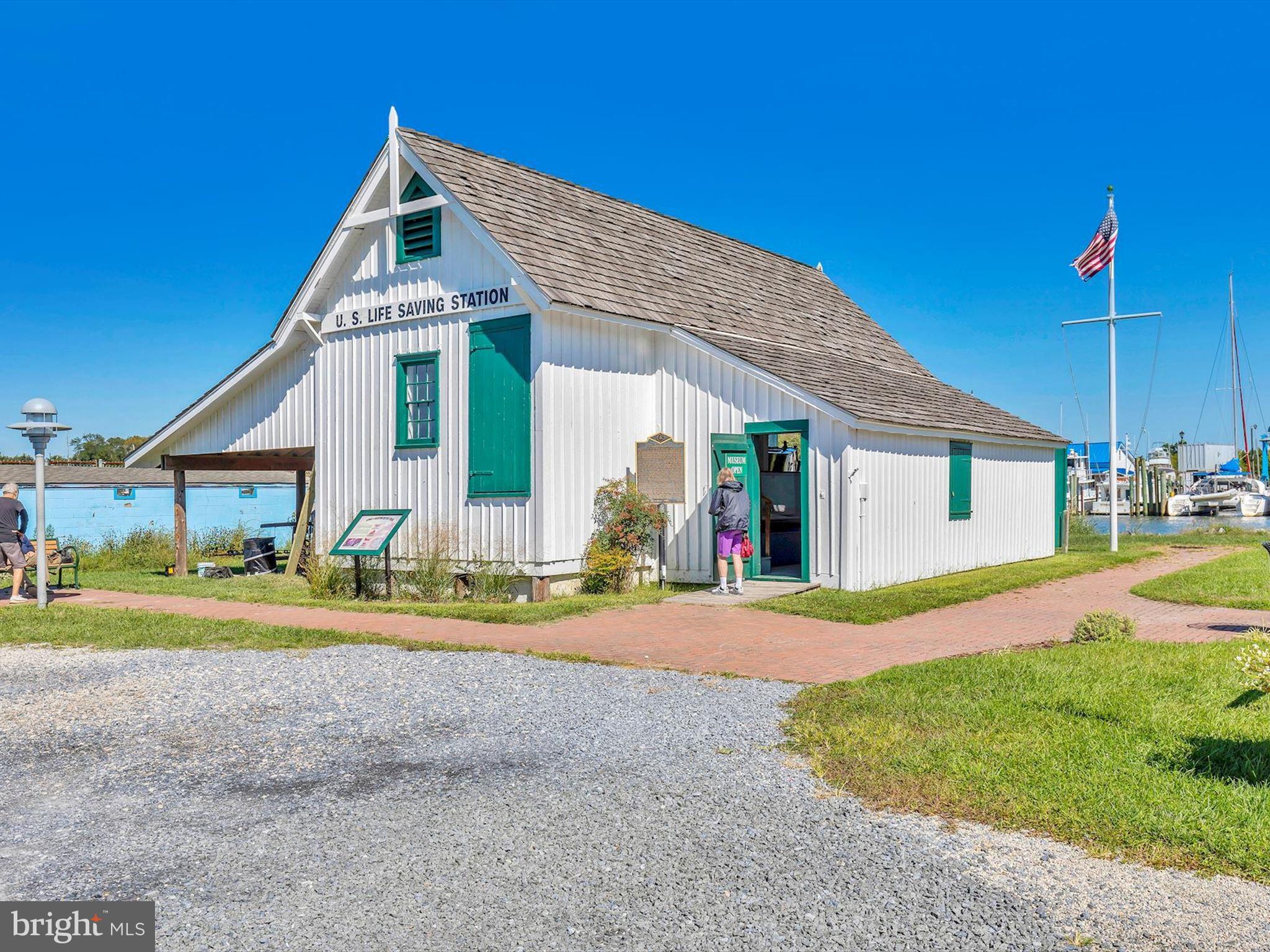 21650 Eastbridge Loop Lewes, DE 19958 - Photo 91 of 106 a front view of a house with a yard and garage