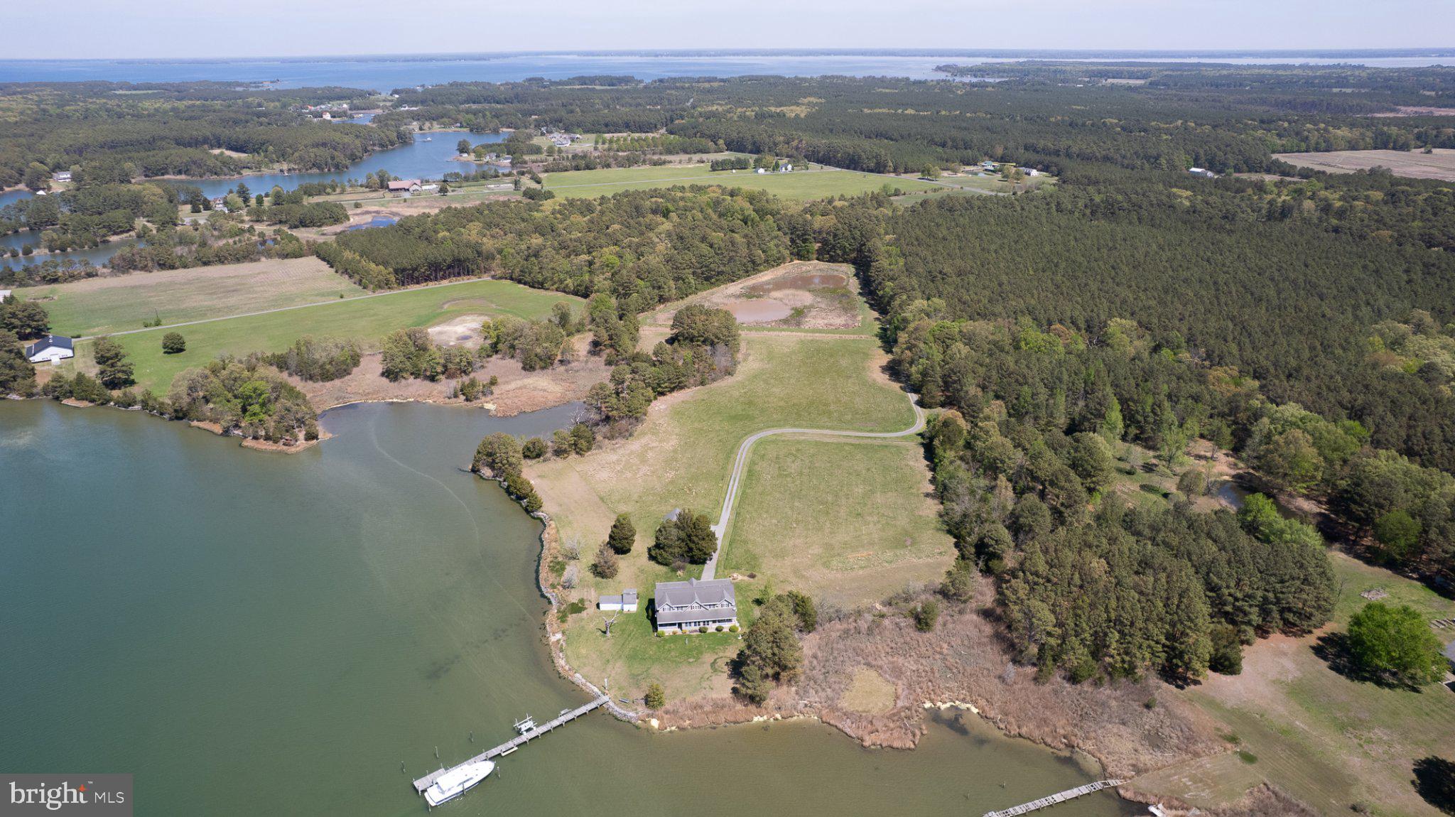 5704 Ross Neck Road Cambridge, MD 21613 - Photo 12 of 98 Serene lakeside retreat with lush land.