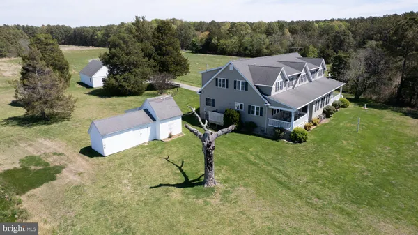 a view of a house with a yard and plants