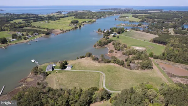 an aerial view of a house with a lake view