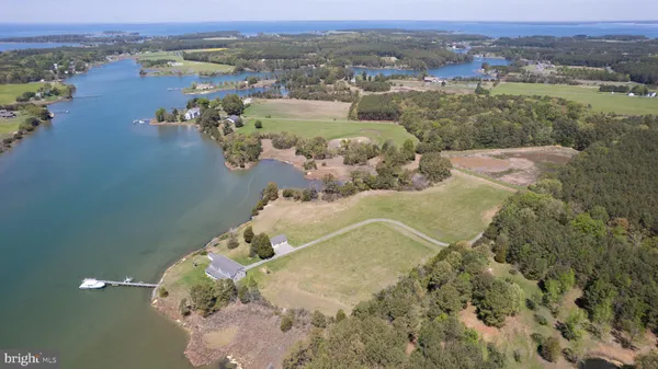 a view of a lake with trees by side of it