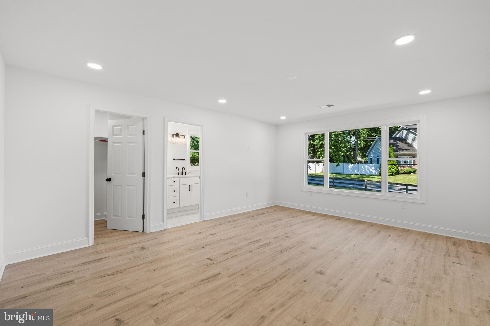 7129 Catlett Street Springfield, VA 22151 - Photo 16 of 34 wooden floor in an empty room with a window