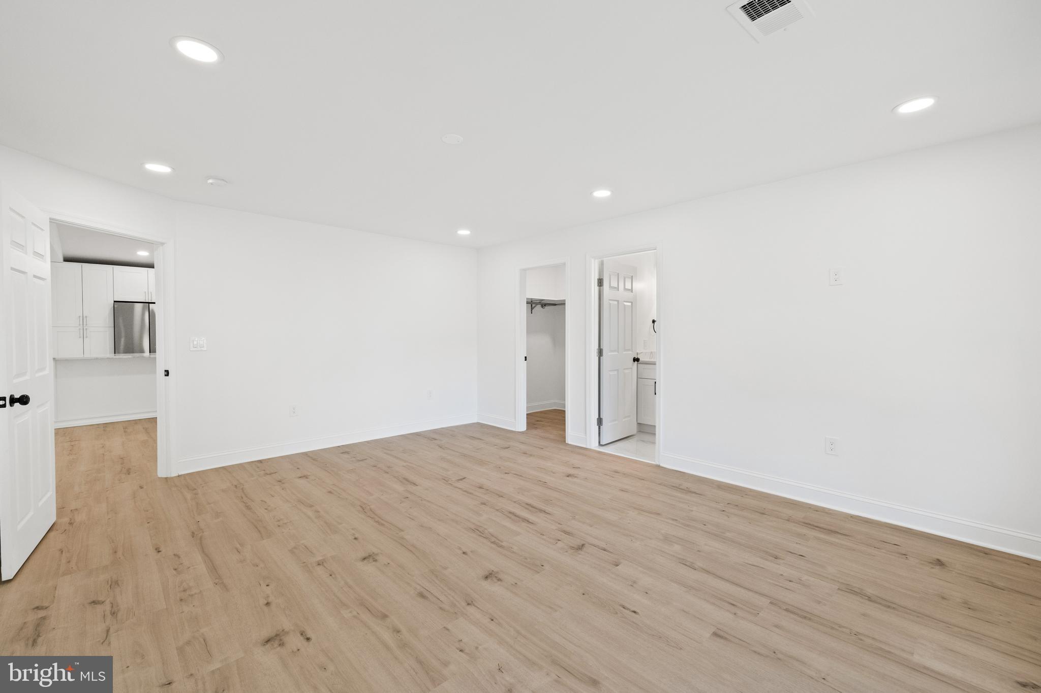 7129 Catlett Street Springfield, VA 22151 - Photo 17 of 34 a view of an empty room with wooden floor