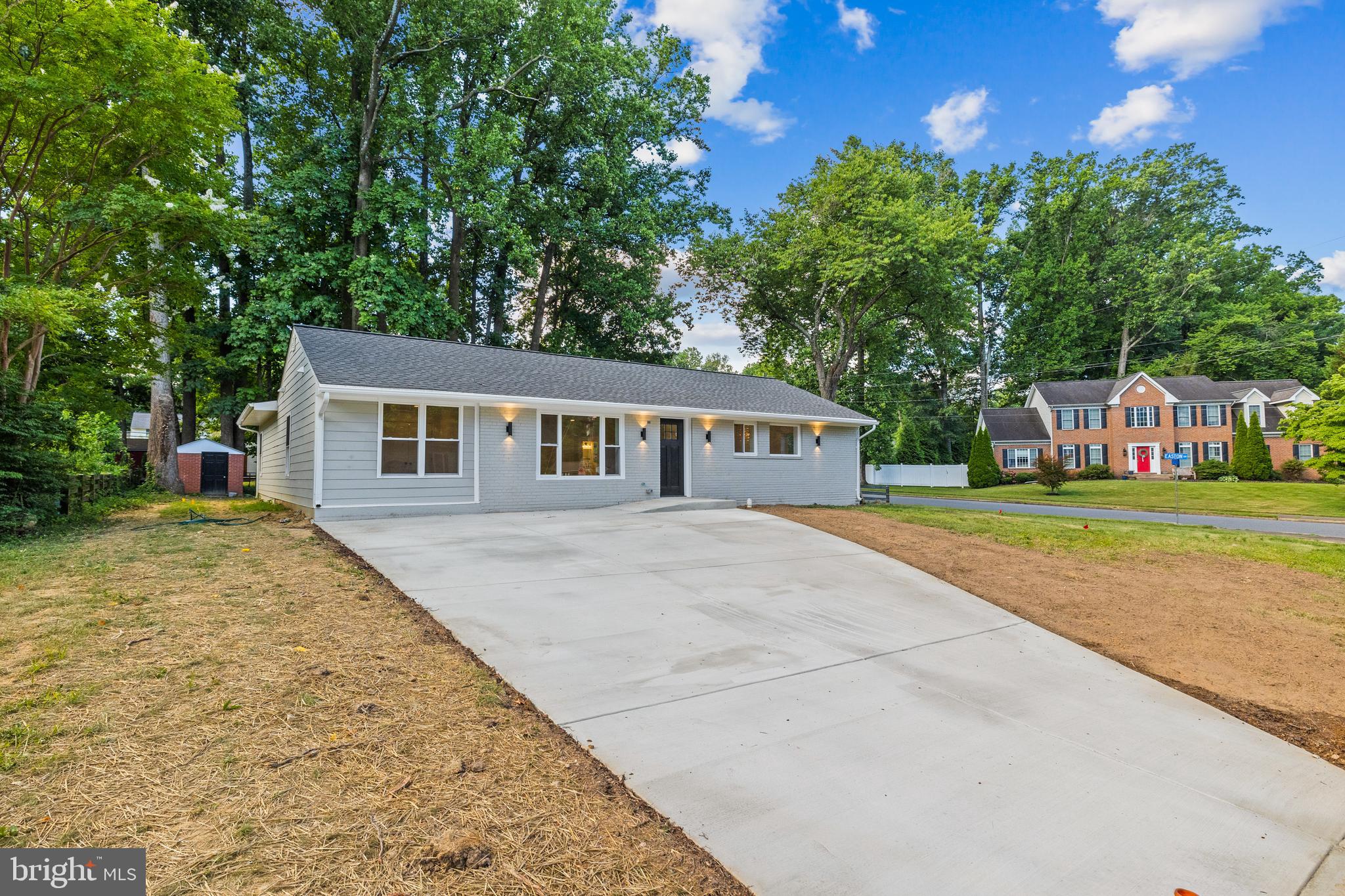 7129 Catlett Street Springfield, VA 22151 - Photo 2 of 34 a front view of a house with garden