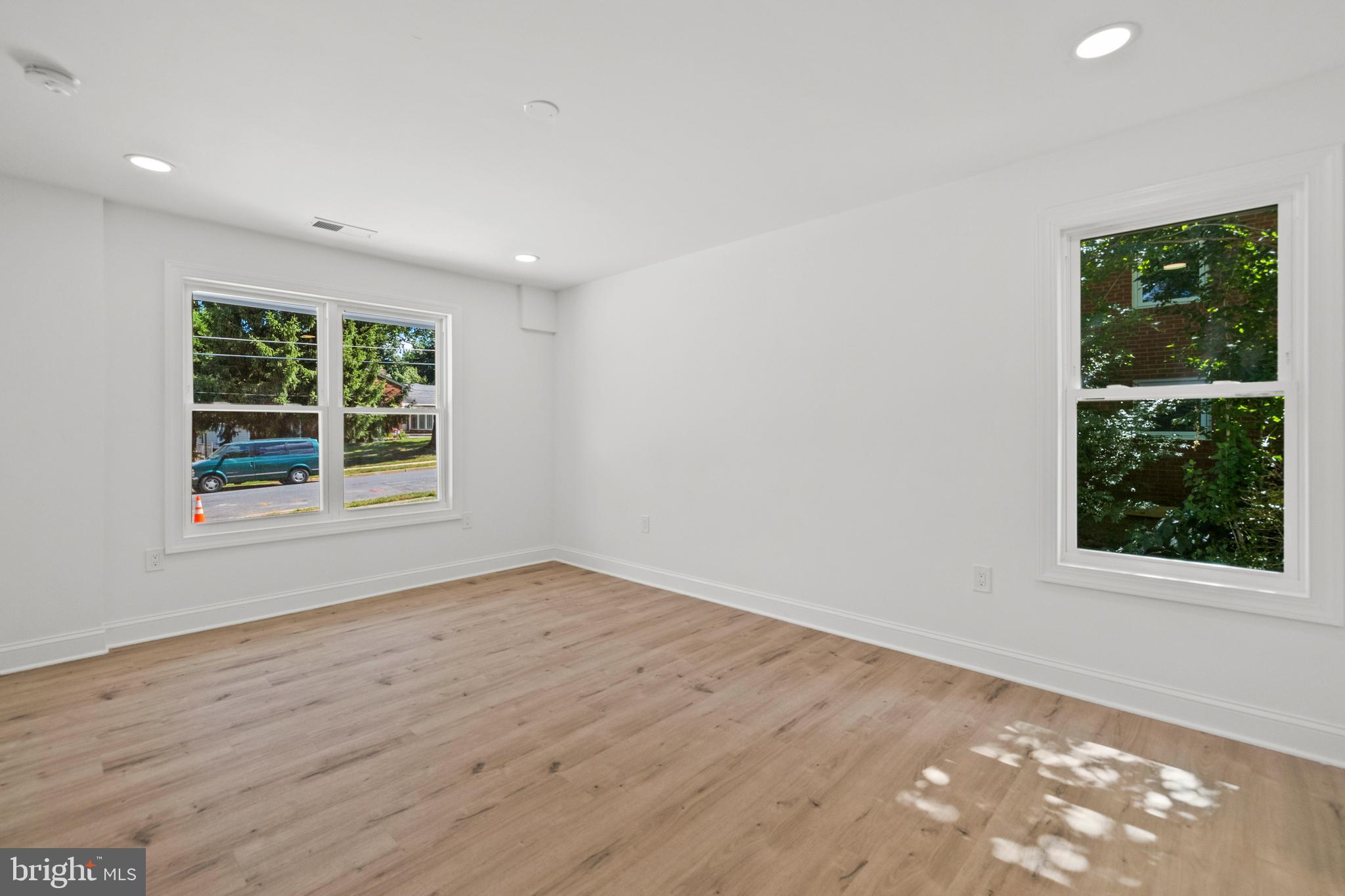 7129 Catlett Street Springfield, VA 22151 - Photo 26 of 34 an empty room with wooden floor and windows
