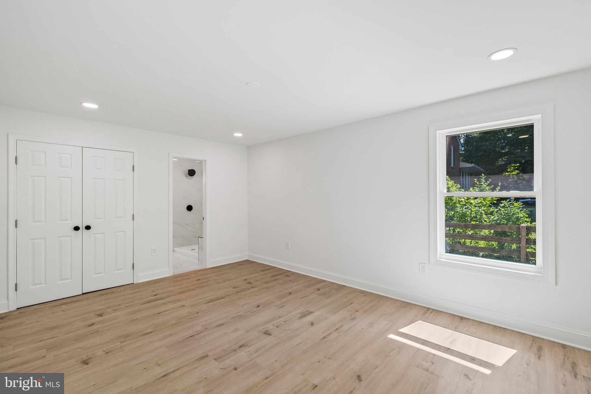 7129 Catlett Street Springfield, VA 22151 - Photo 29 of 34 an empty room with wooden floor and window