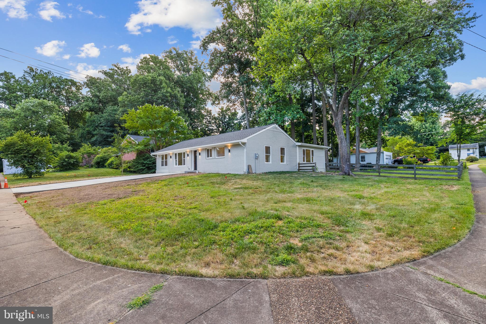 7129 Catlett Street Springfield, VA 22151 - Photo 3 of 34 a view of a house with a backyard porch and sitting area