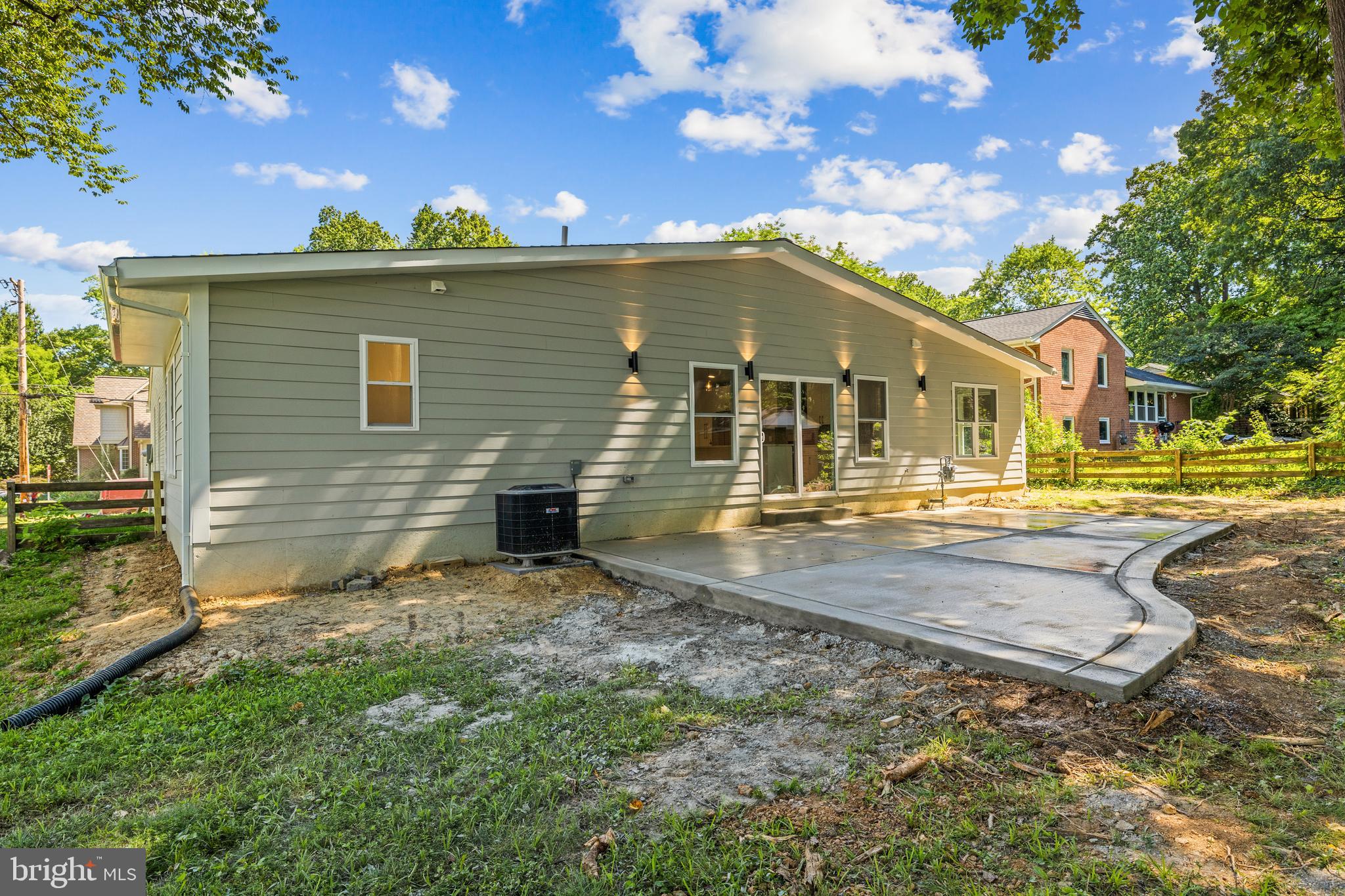 7129 Catlett Street Springfield, VA 22151 - Photo 32 of 34 a view of a house with backyard and sitting area