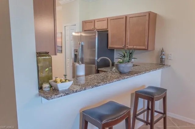 a kitchen with a table and chairs