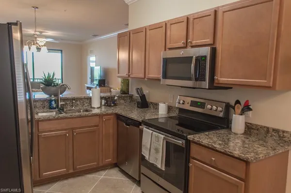 a dining room with chandelier and window