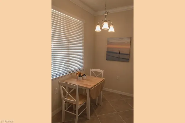 a bedroom with a bed and a lamp