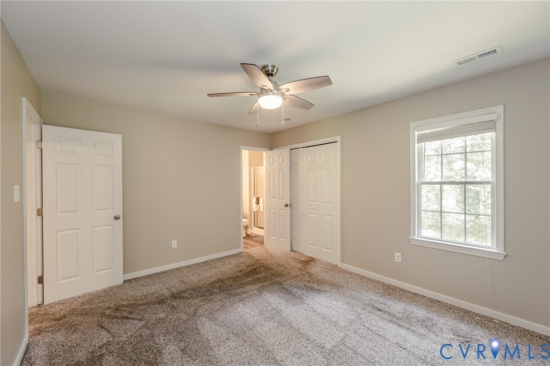 3024 Gregwood Road Midlothian, VA 23112 - Photo 26 of 49 Primary bedroom featuring carpet floors, a closet,