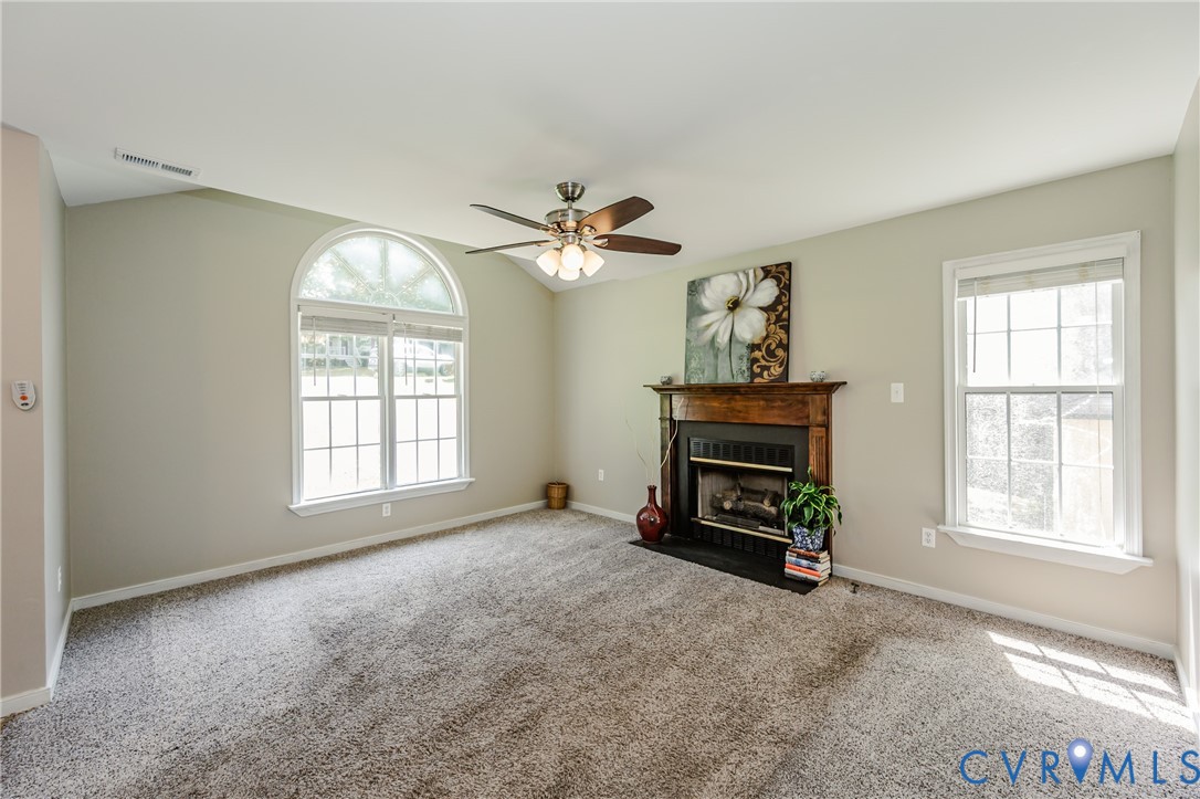 3024 Gregwood Road Midlothian, VA 23112 - Photo 10 of 49 Unfurnished living room featuring a fireplace with