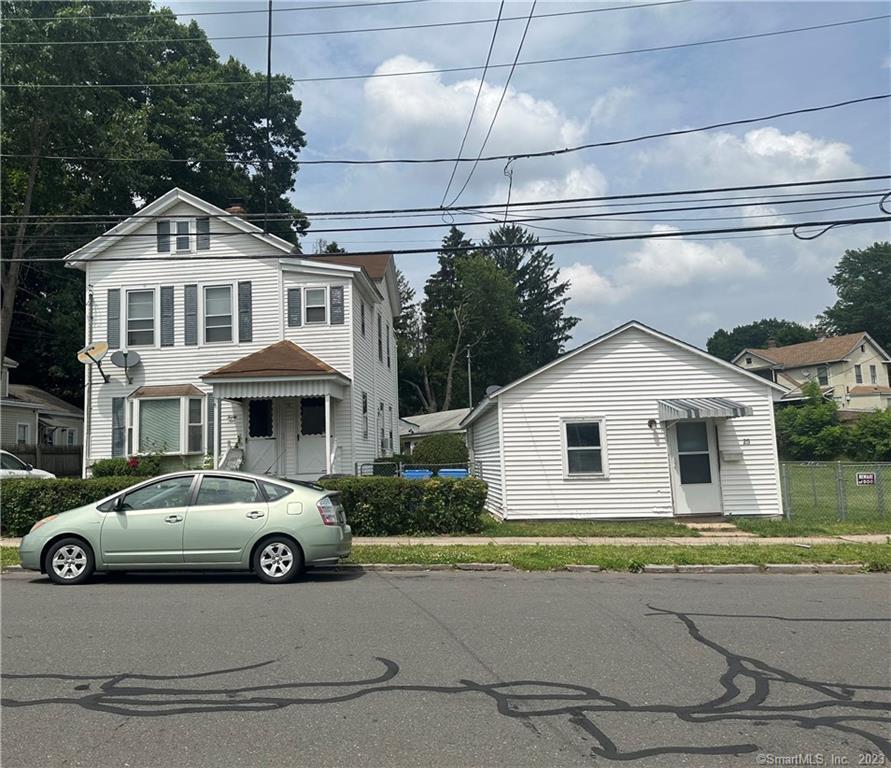 25 Locust Street New Britain, CT 06051 - Photo 1 of 1 a car parked in front of a white house