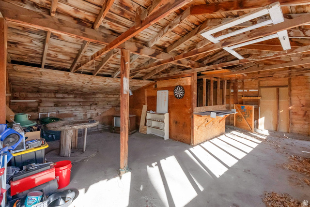 654 North 100 East Logan, UT 84321 - Photo 23 of 41 Carport featuring unfinished concrete floors and vaulted ceiling