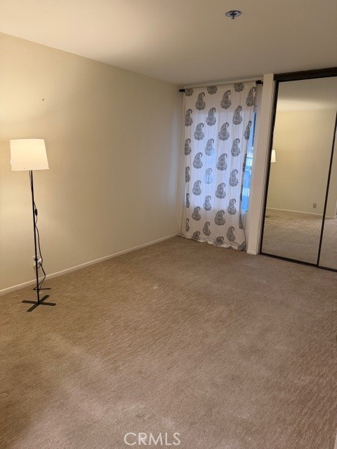 351 North Ford Avenue, Unit 213 Fullerton, CA 92832 - Photo 11 of 13 a view of an empty room with a door
