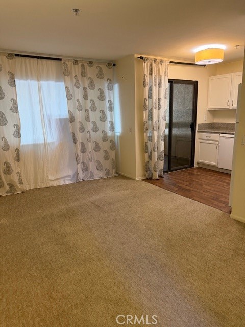 351 North Ford Avenue, Unit 213 Fullerton, CA 92832 - Photo 6 of 13 a view of an empty room with a fireplace