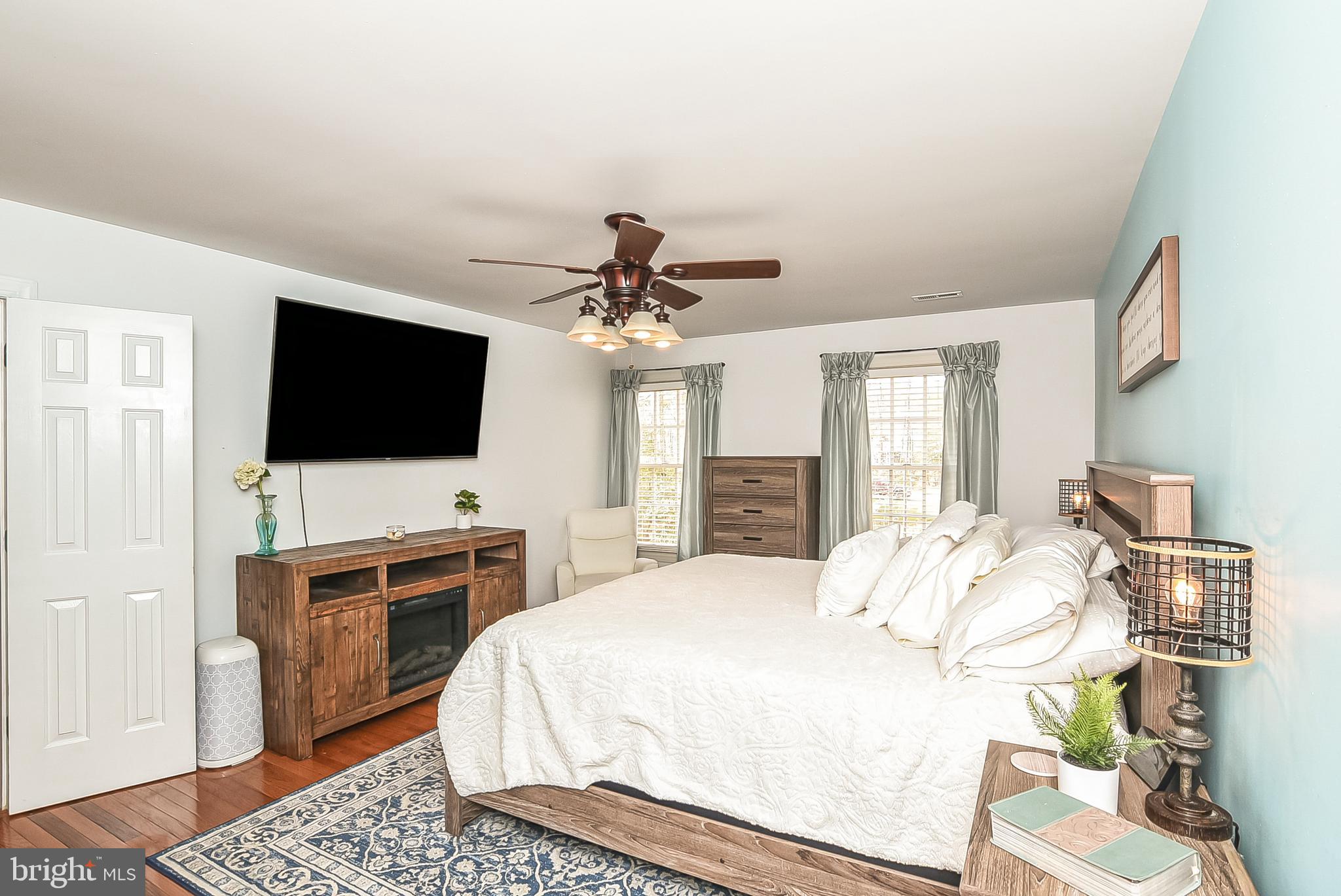 12517 Kent Road King George, VA 22485 - Photo 27 of 65 Primary Bedroom with Ceiling Fan & Hardwood Floors