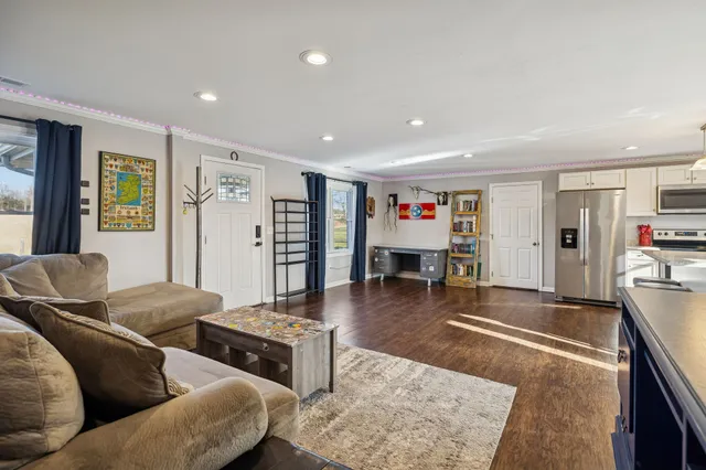 a living room with furniture and a table