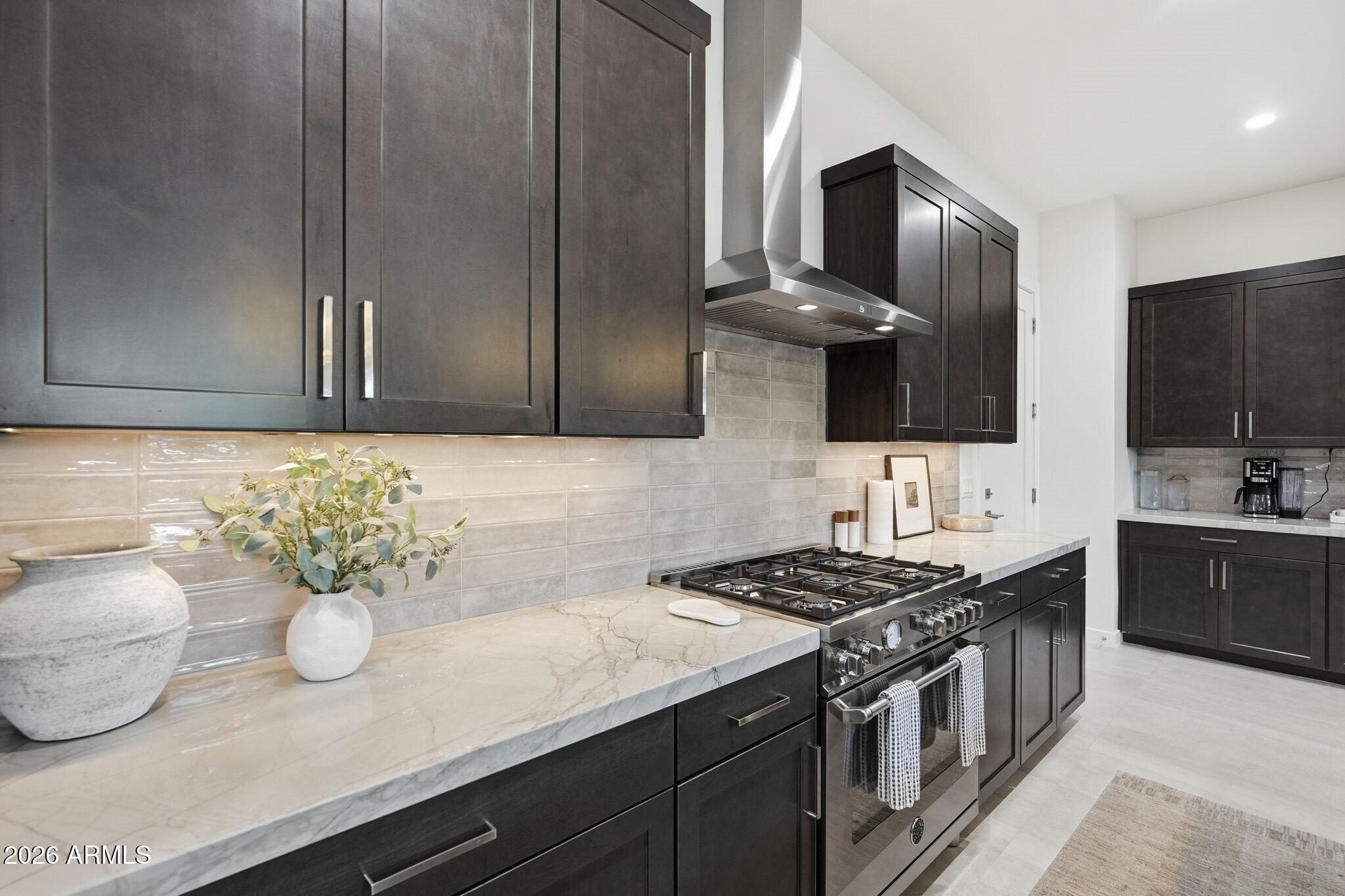 6525 East Cave Creek Road, Unit 201 Cave Creek, AZ 85331 - Photo 11 of 33 a kitchen with stainless steel appliances a sink a stove and cabinets