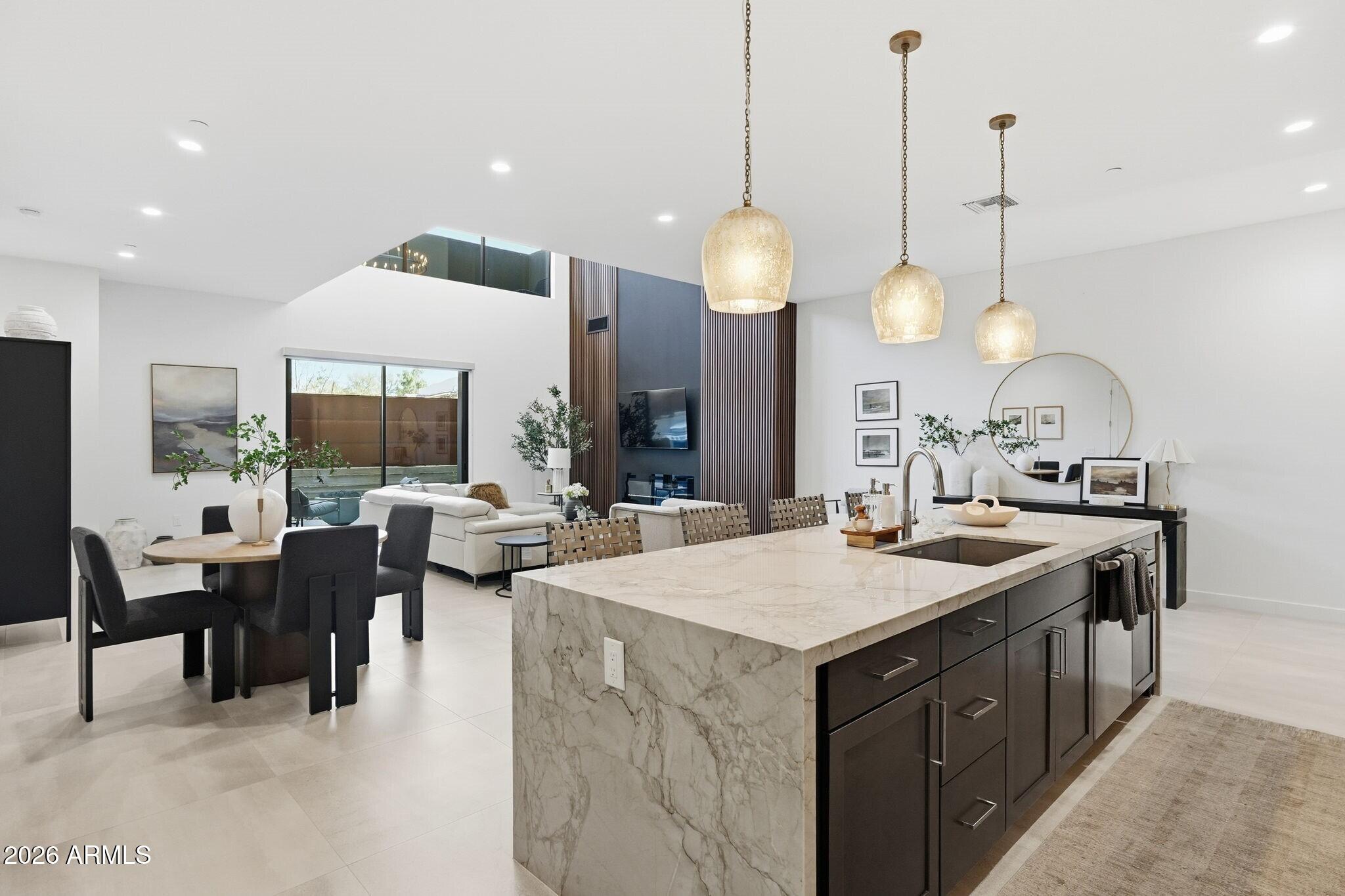 6525 East Cave Creek Road, Unit 201 Cave Creek, AZ 85331 - Photo 13 of 33 a large kitchen with kitchen island a large island in it