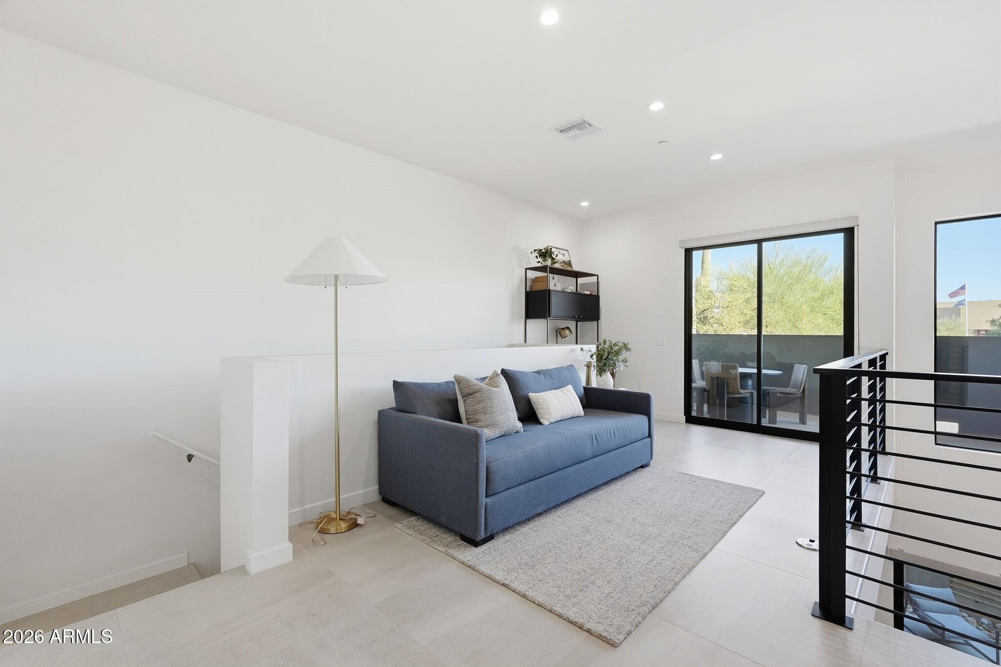 6525 East Cave Creek Road, Unit 201 Cave Creek, AZ 85331 - Photo 14 of 33 a living room with furniture and a large window