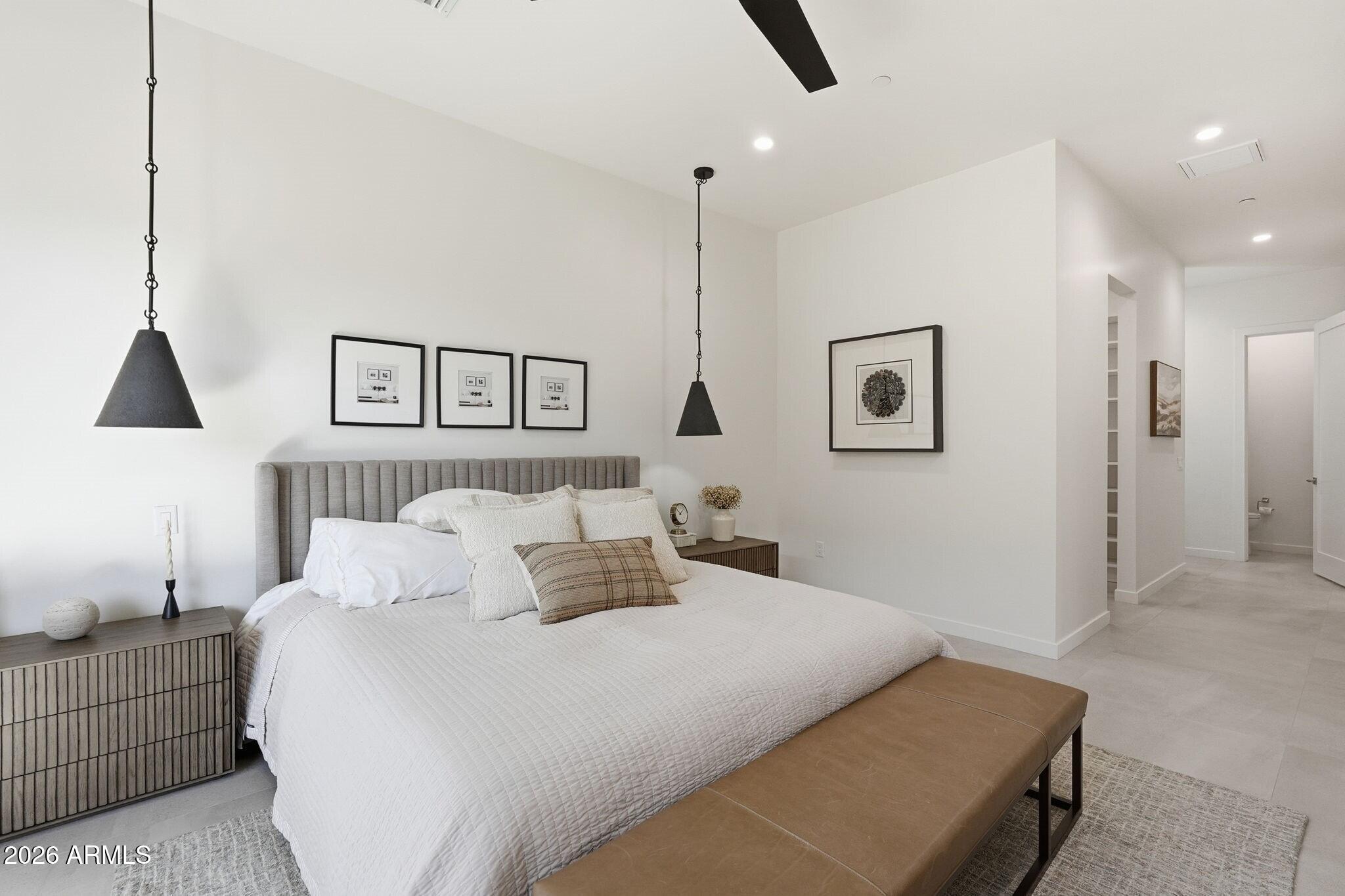 6525 East Cave Creek Road, Unit 201 Cave Creek, AZ 85331 - Photo 18 of 33 a bedroom with a bed and lamp