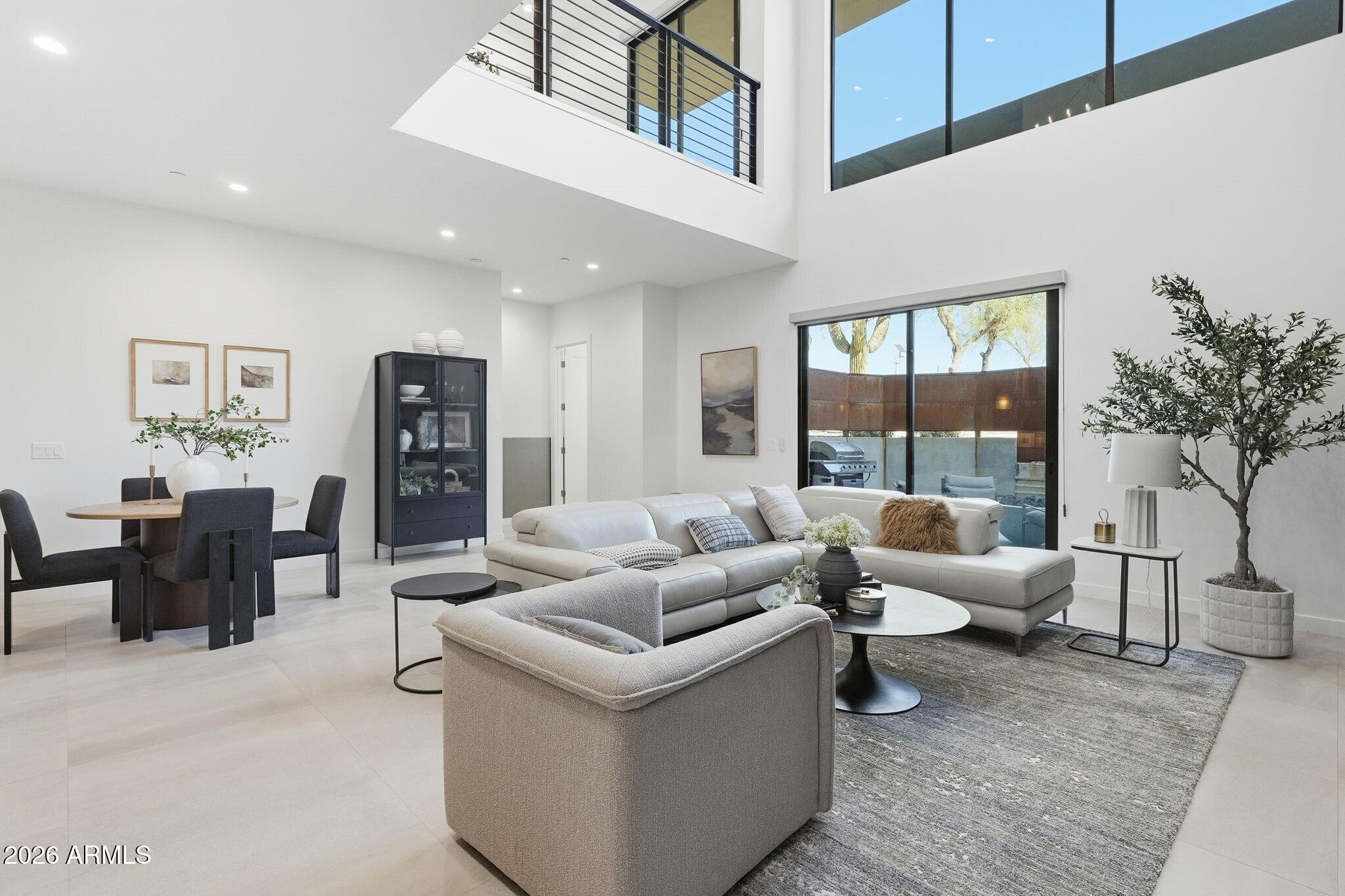 6525 East Cave Creek Road, Unit 201 Cave Creek, AZ 85331 - Photo 4 of 33 a living room with furniture and a potted plant