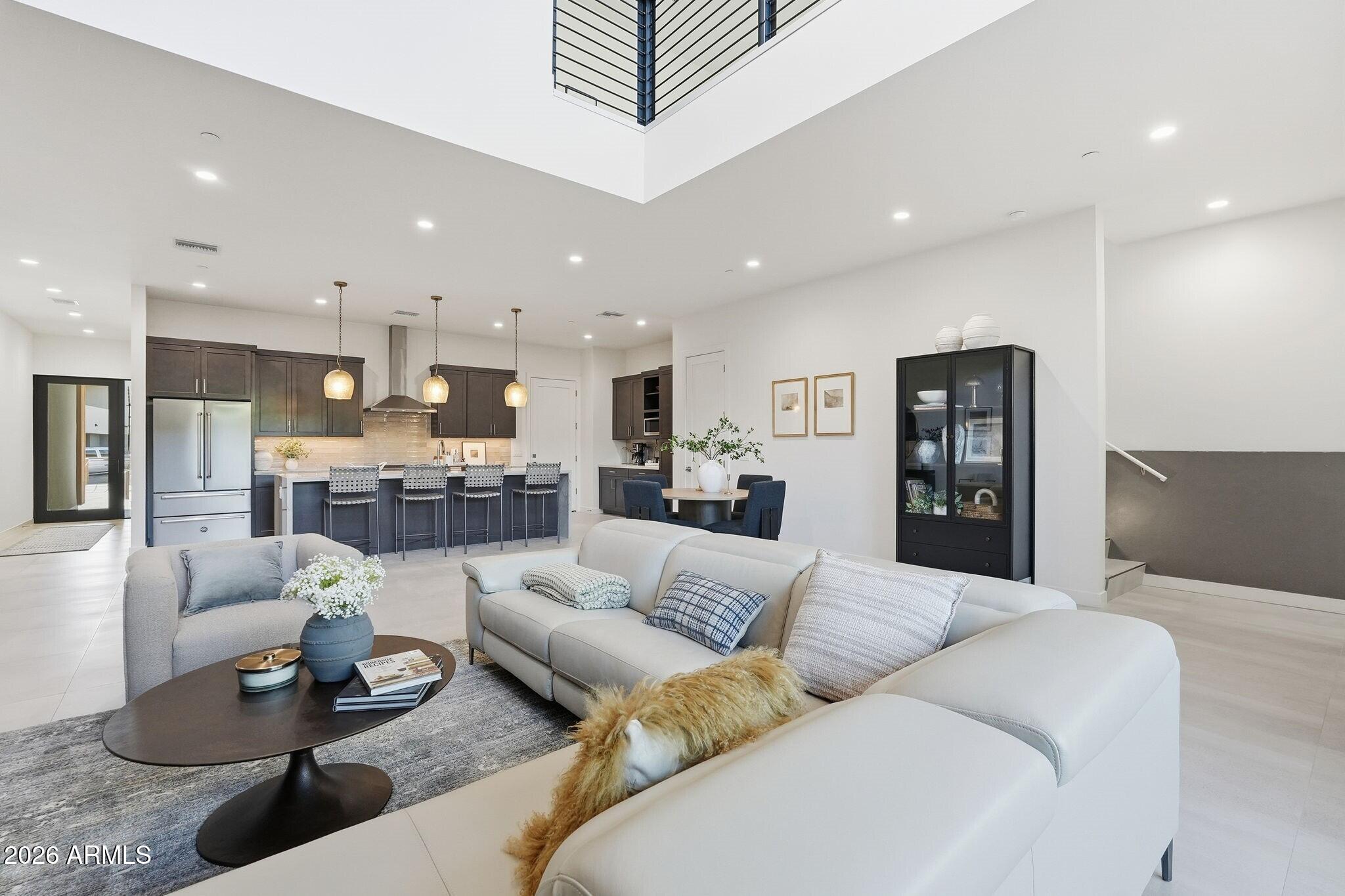 6525 East Cave Creek Road, Unit 201 Cave Creek, AZ 85331 - Photo 7 of 33 a living room with furniture and kitchen view