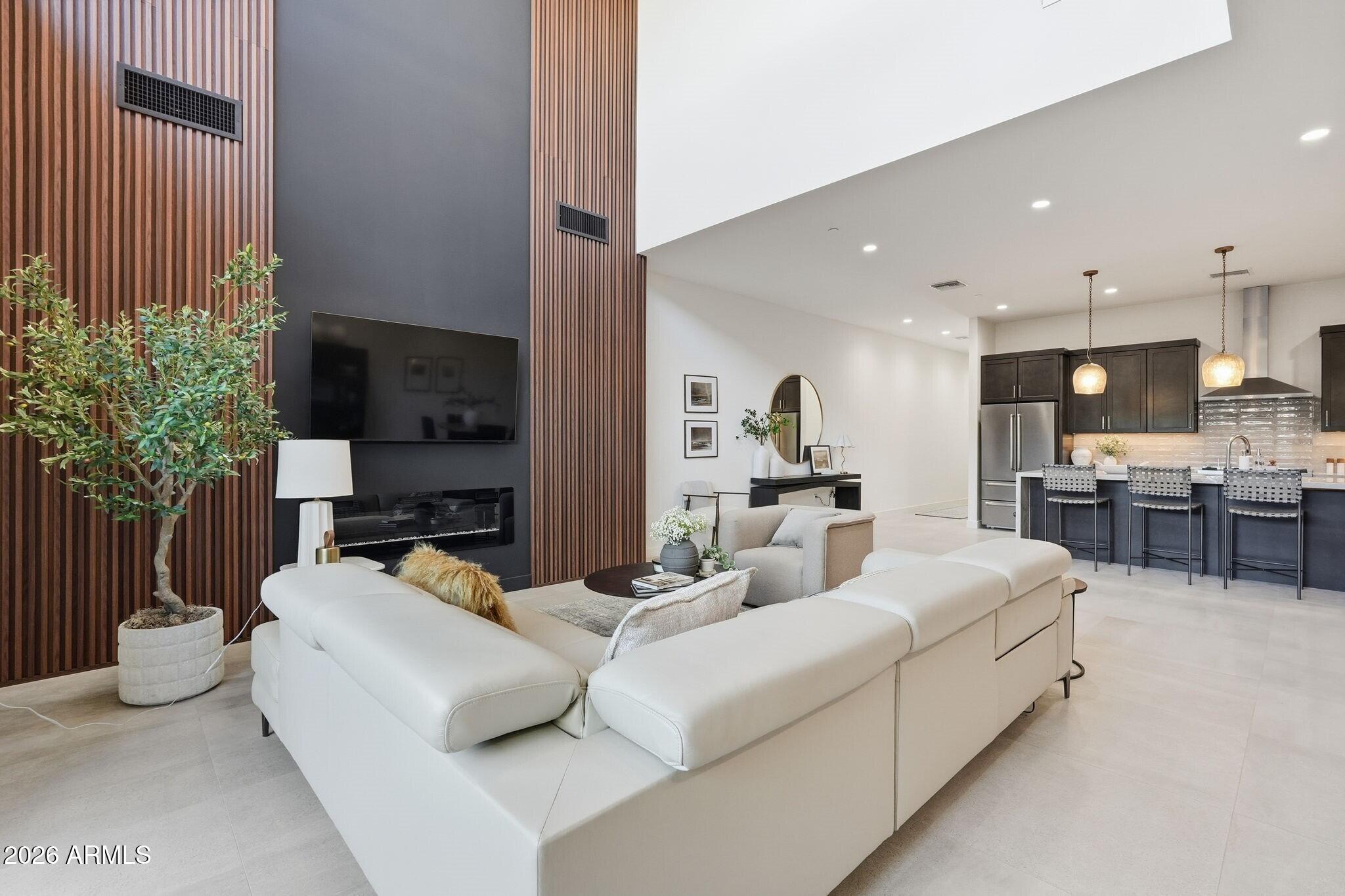 6525 East Cave Creek Road, Unit 201 Cave Creek, AZ 85331 - Photo 8 of 33 a living room with furniture and a potted plant