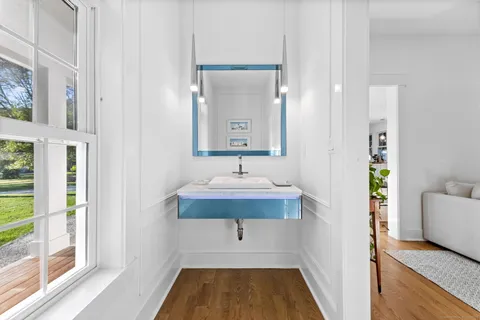 a bathroom with a sink and a mirror
