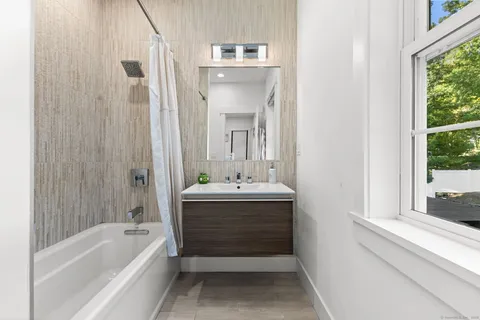 a bathroom with a bathtub and a sink