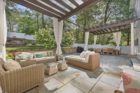 a outdoor space with patio couch and wooden floor