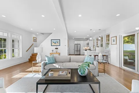 a living room with furniture and a table