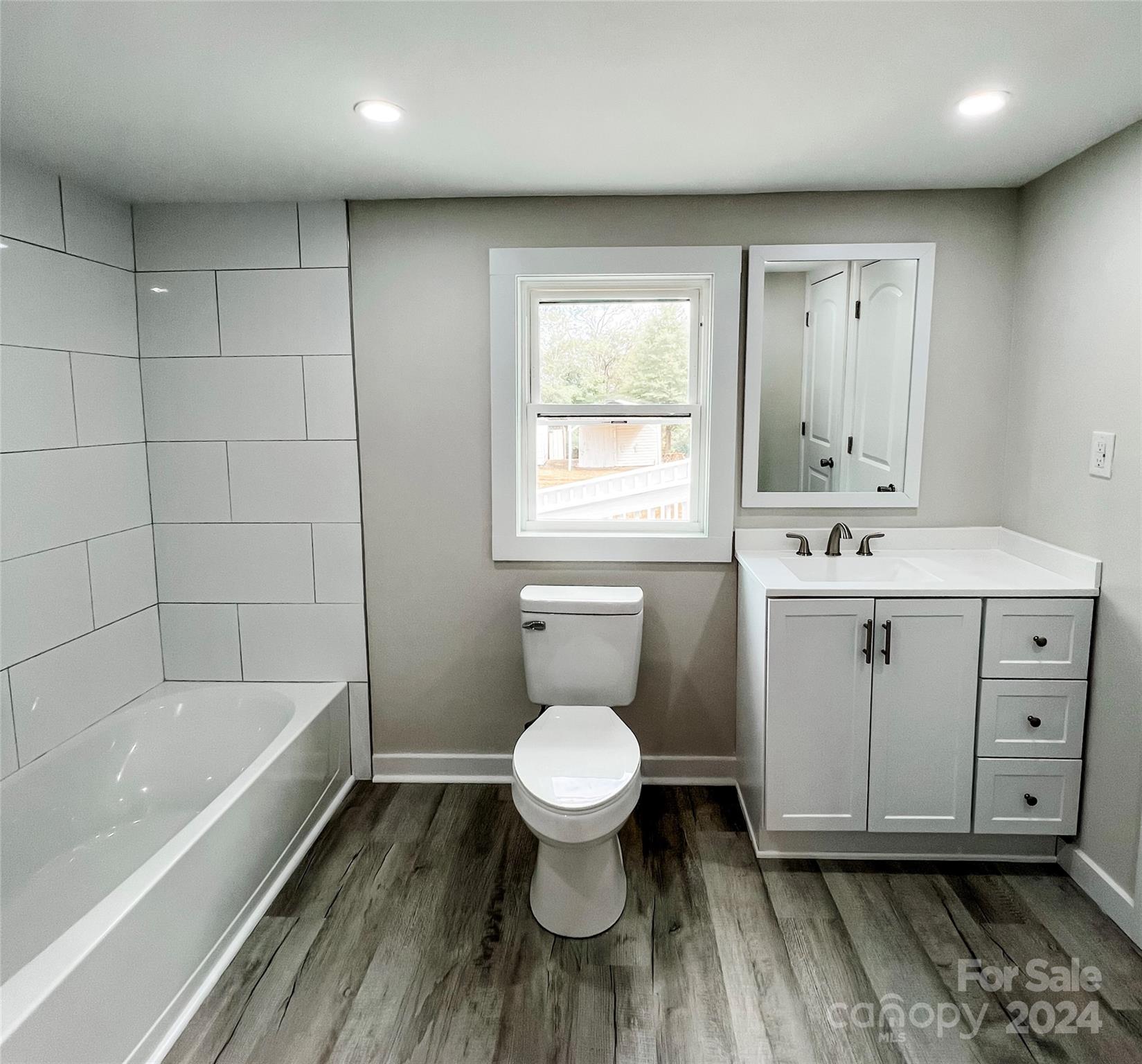 816 Laton Road Albemarle, NC 28001 - Photo 20 of 28 a bathroom with a toilet sink and mirror