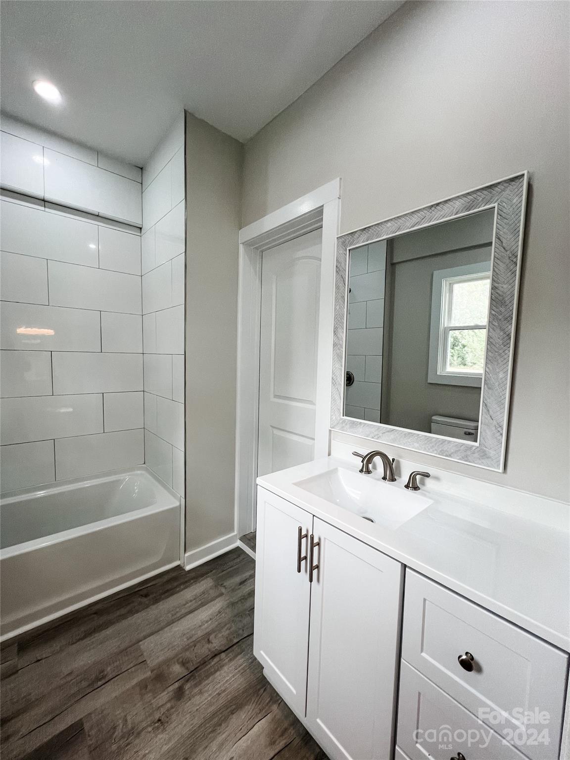 816 Laton Road Albemarle, NC 28001 - Photo 22 of 28 a bathroom with a sink and a mirror