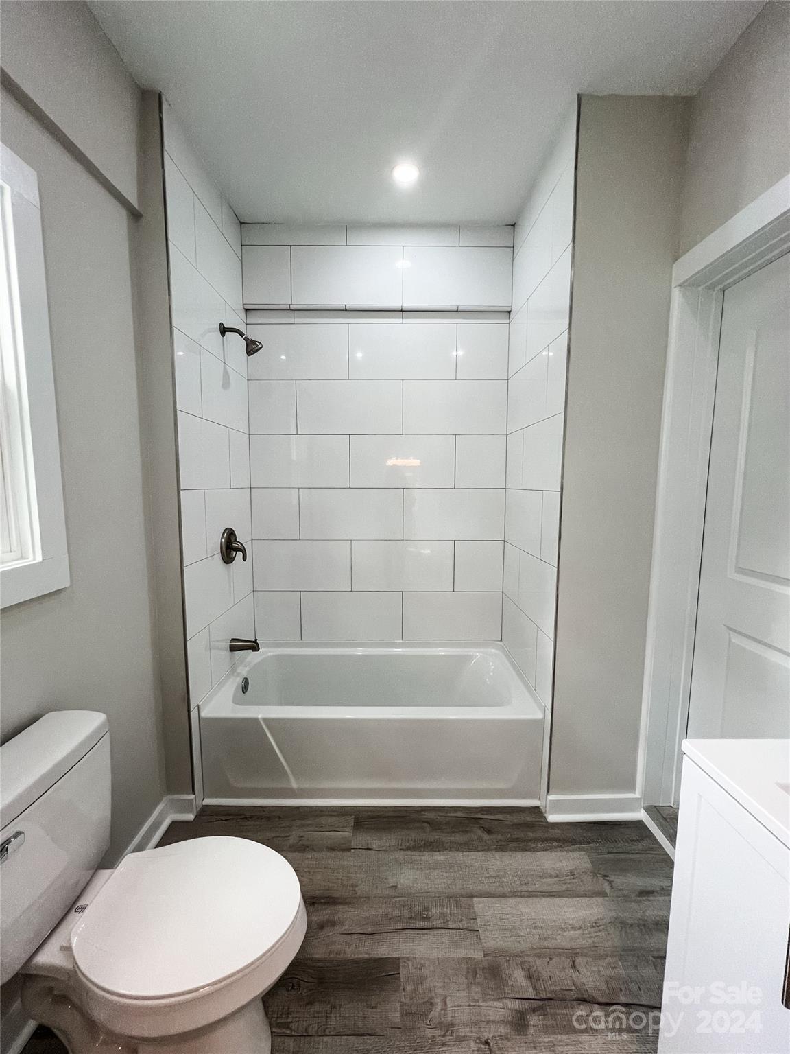 816 Laton Road Albemarle, NC 28001 - Photo 23 of 28 a bathroom with a toilet and a bath tub