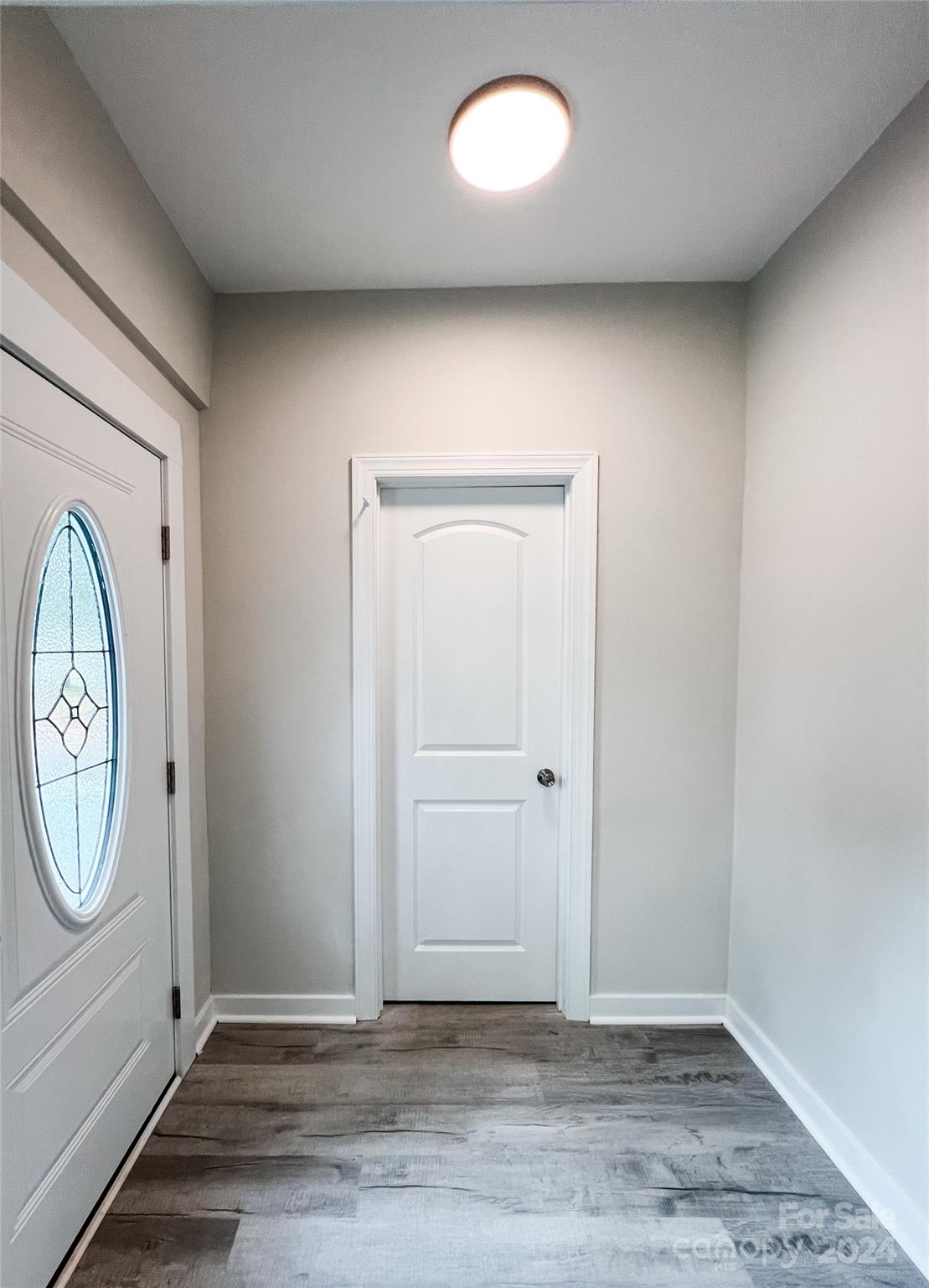816 Laton Road Albemarle, NC 28001 - Photo 24 of 28 an empty room with wooden floor and window