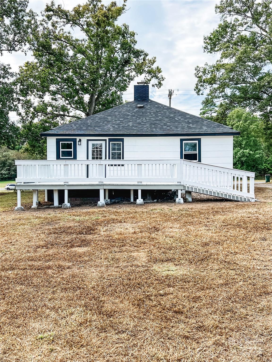 816 Laton Road Albemarle, NC 28001 - Photo 4 of 28 a house that has a tree in front of a white house