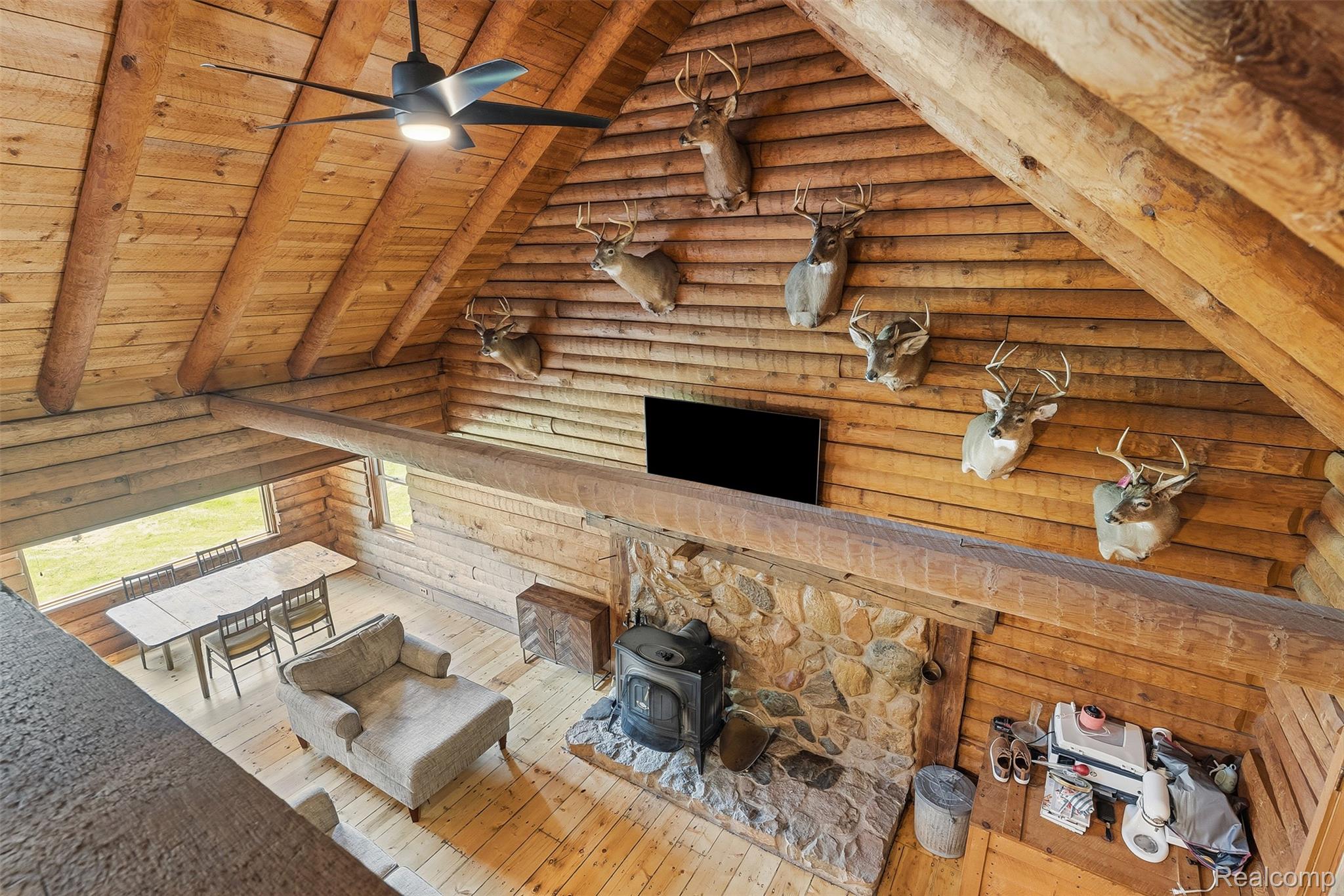 3656 Stanley Road Columbiaville, MI 48421 - Photo 27 of 65 Vaulted wood-finish ceilings featuring exposed beams and a ceiling fan