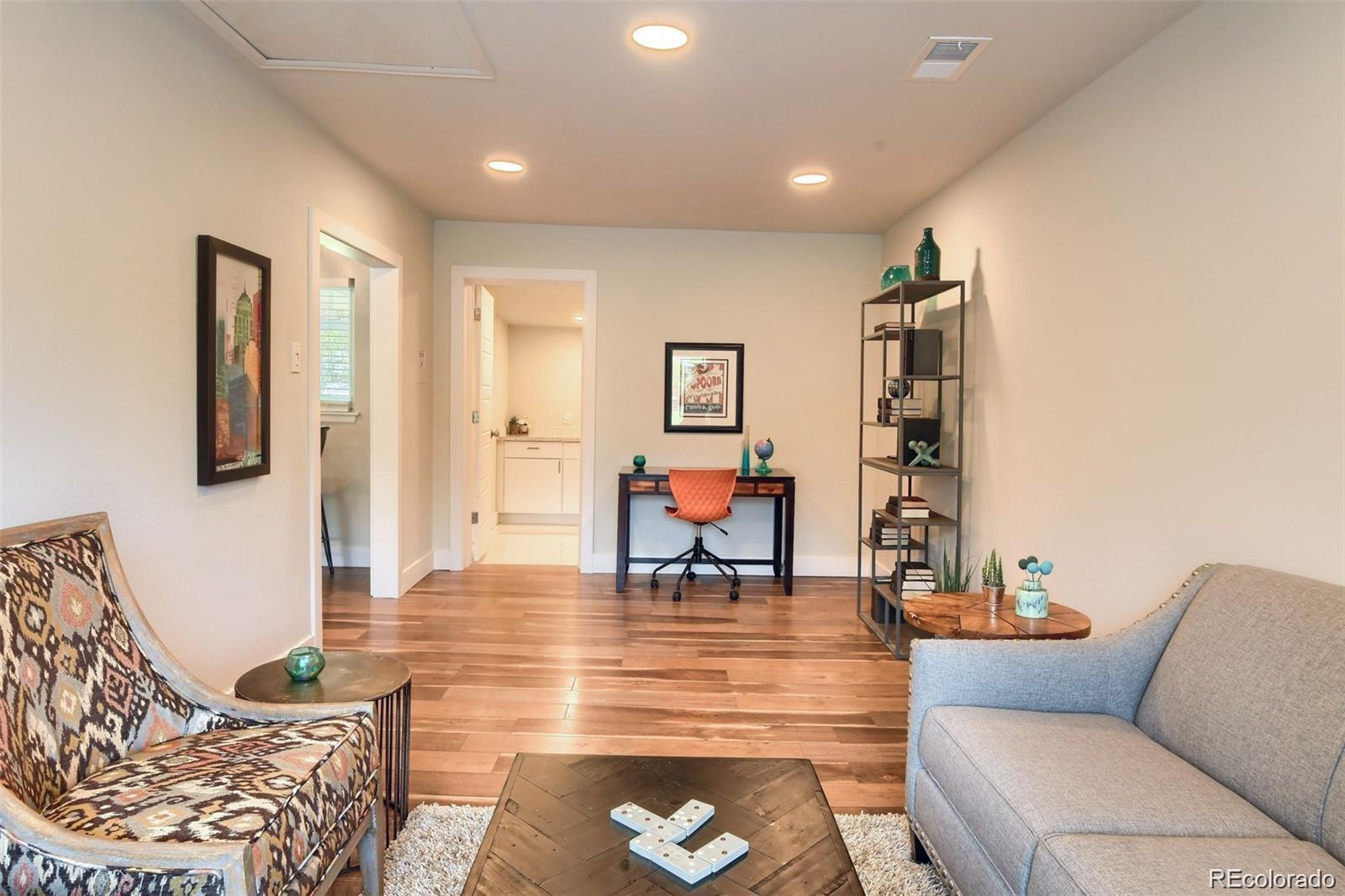 3075 South Grape Way Denver, CO 80222 - Photo 19 of 25 a living room with furniture