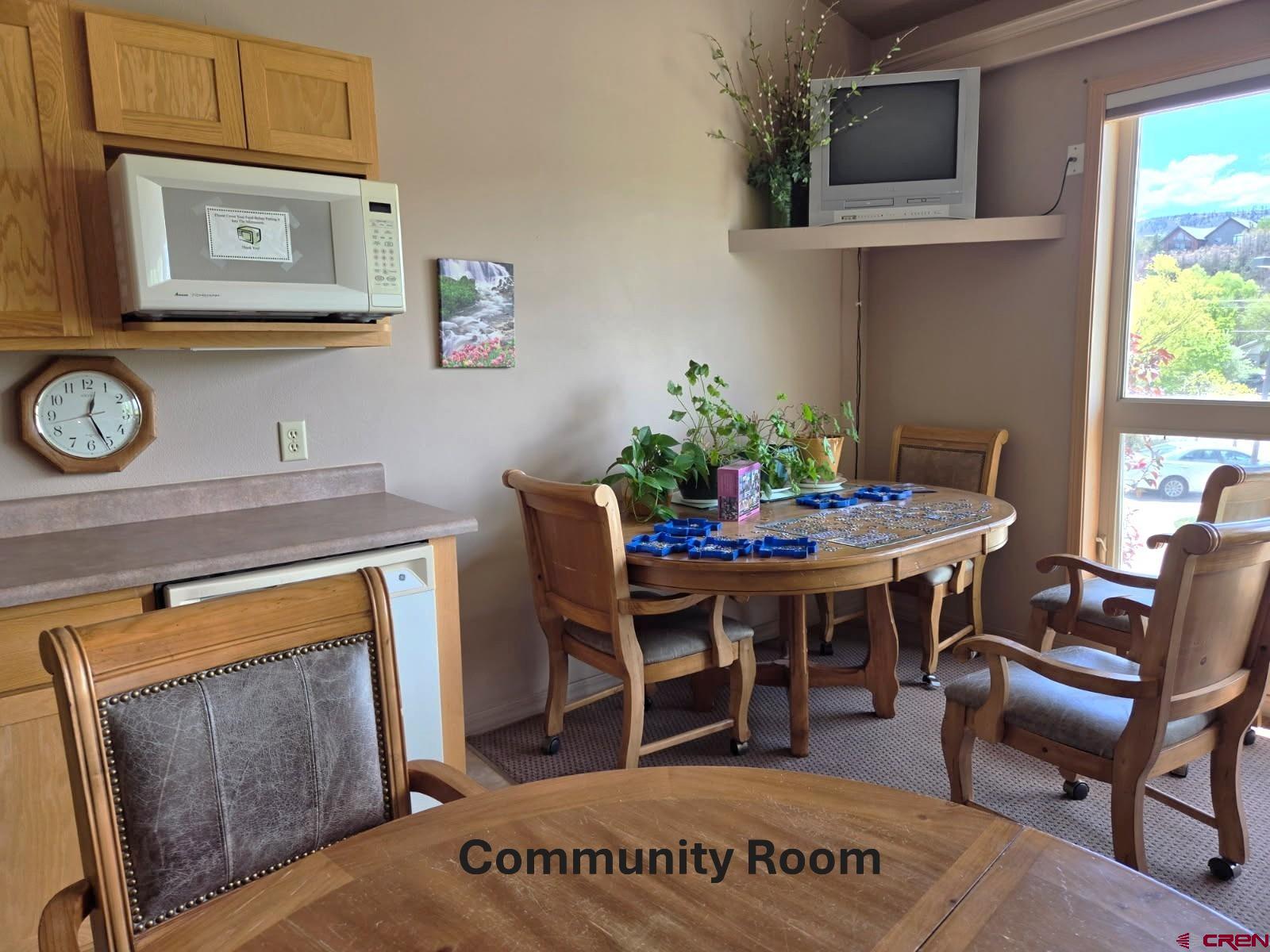 35 Sunshine Court, Unit 6 Durango, CO 81301 - Photo 33 of 37 Tables, television, piano and puzzles.