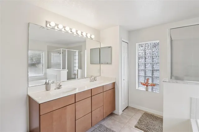 a bathroom with a sink double vanity and a mirror