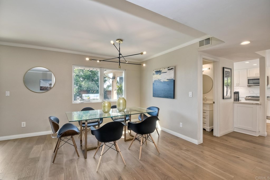 631 Dell Street Solana Beach, CA 92075 - Photo 11 of 36 a view of a dining room with furniture and a chandelier